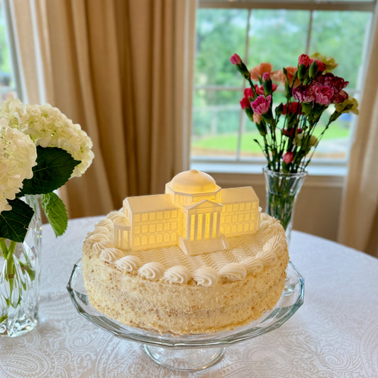 The SMU college cake topper, shown on a graduation cake.