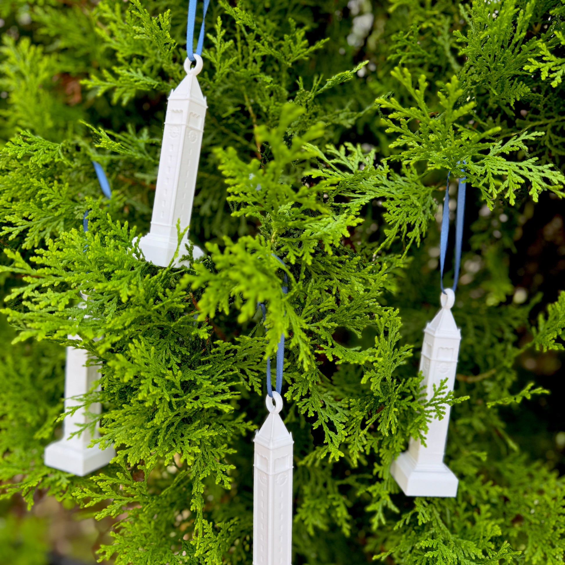 Multiple Berkeley Campanile ornaments, shown on a Christmas tree.