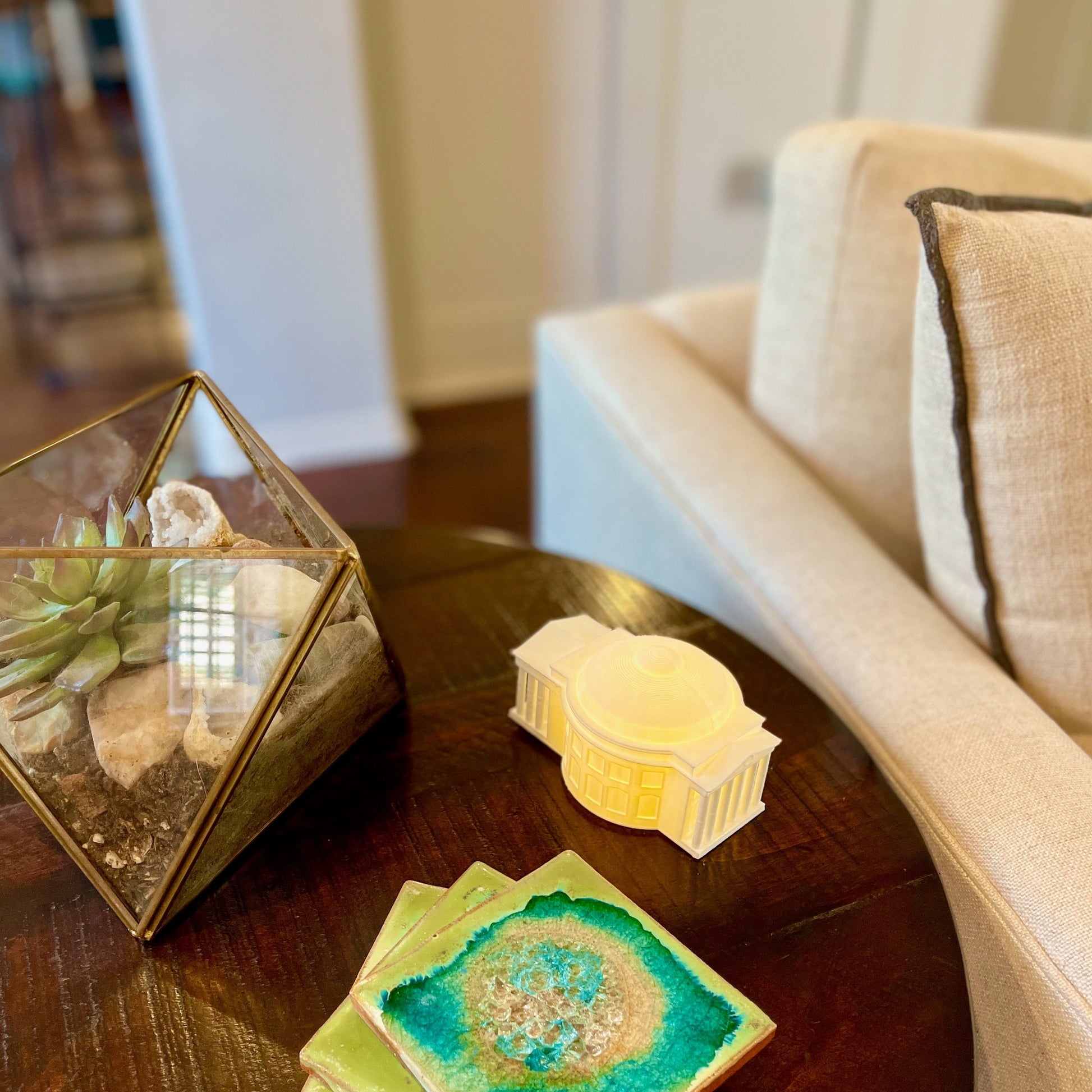 The UVA home decoration, shown on a living room side table.