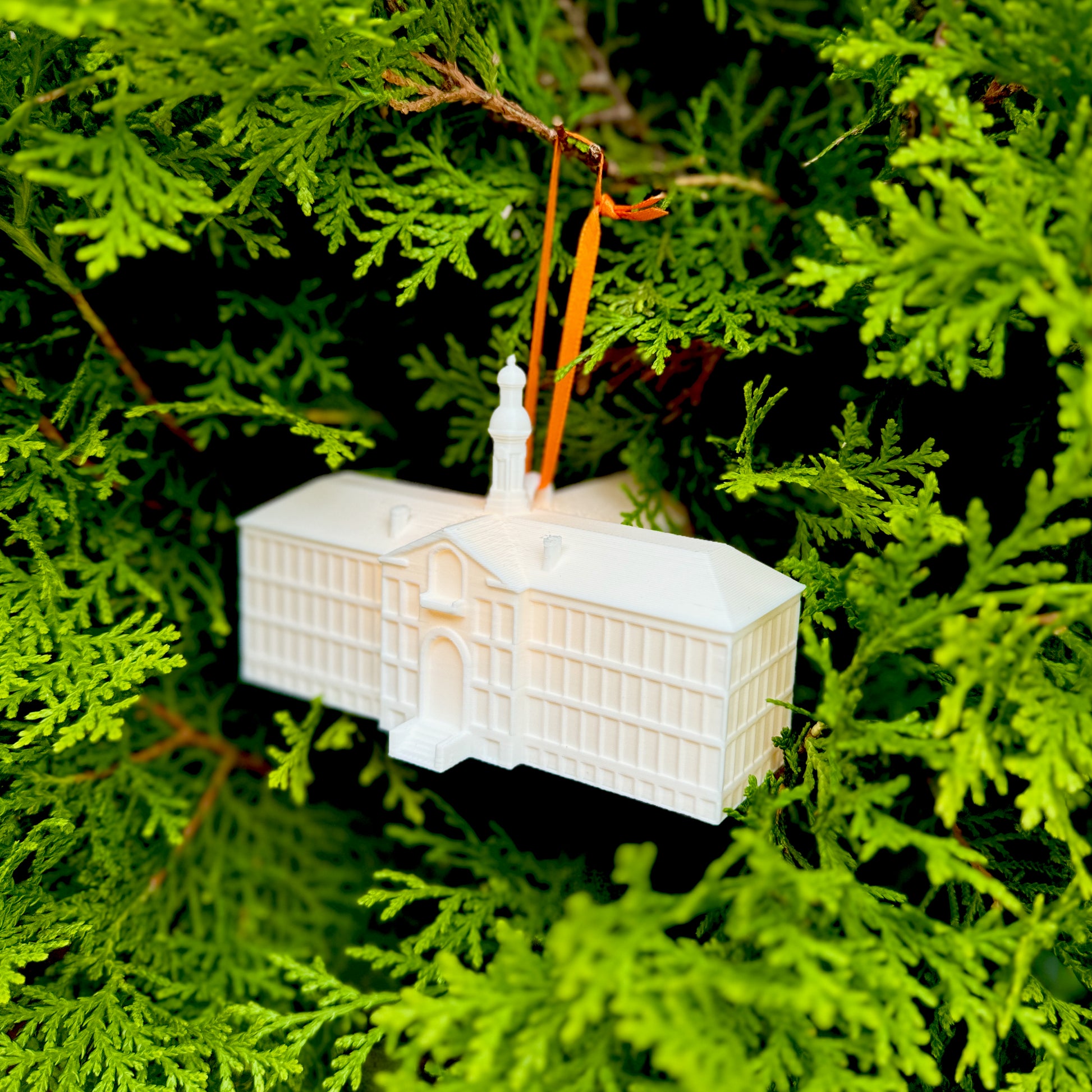 The Princeton Tigers ornament, designed after Nassau Hall and shown on a Christmas tree.