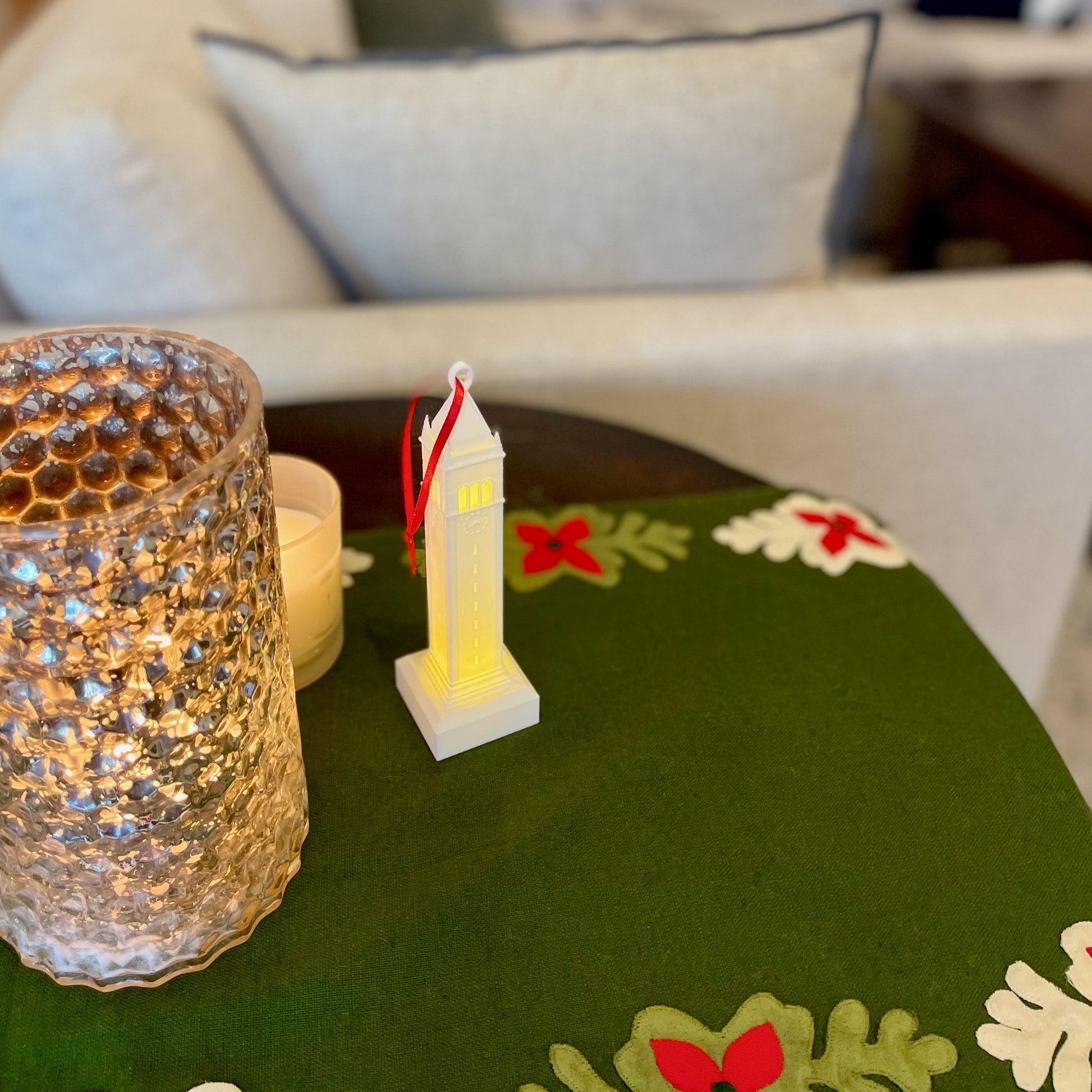 The lighted Berkeley campanile christmas ornament, shown in a home decorated for the holidays.