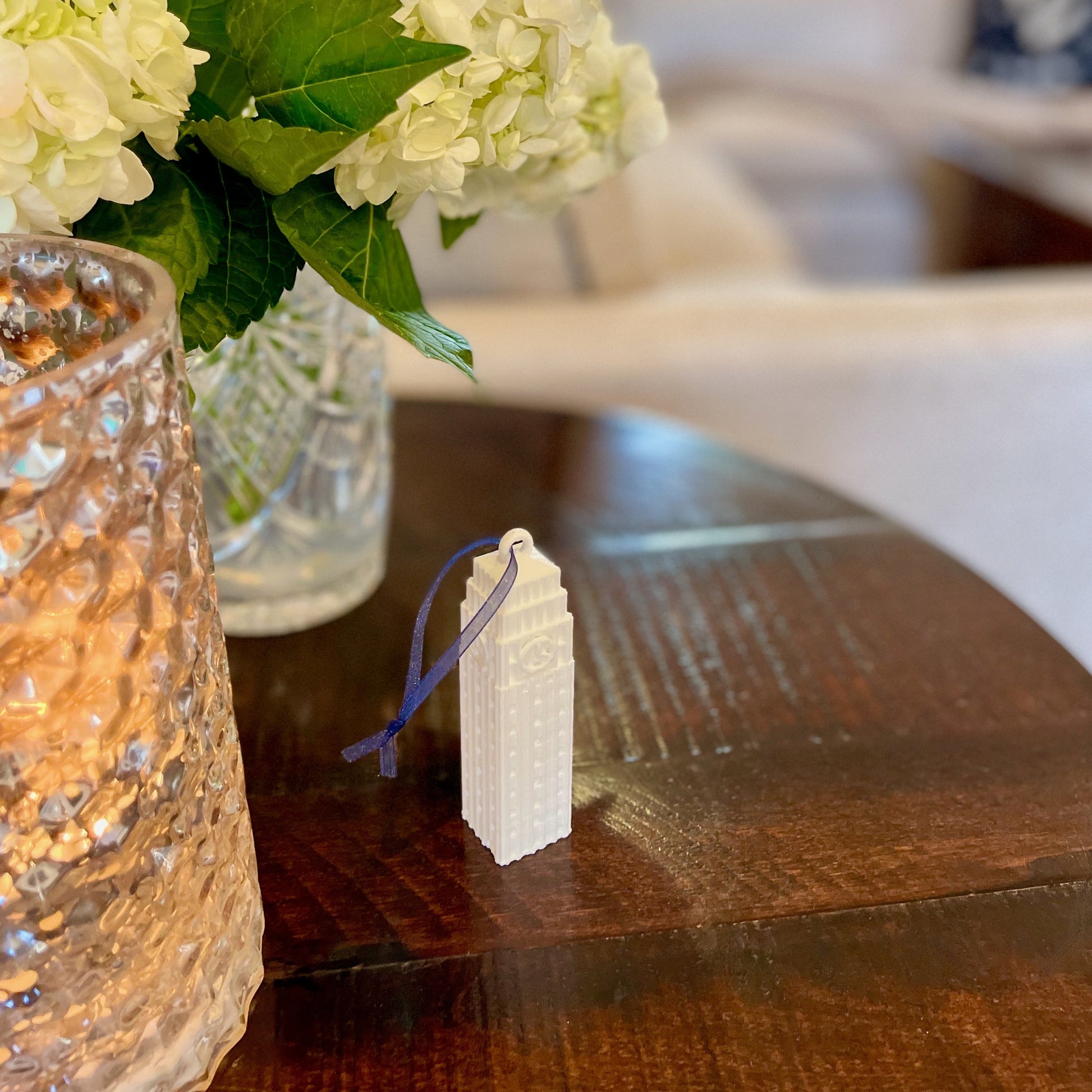 The University of Michigan christmas decoration, shown on a side table.