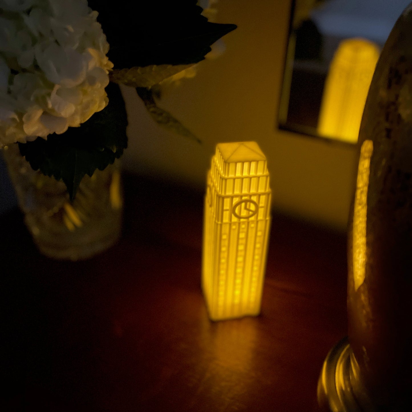 The University of Michigan night light, shown on a bedside table.