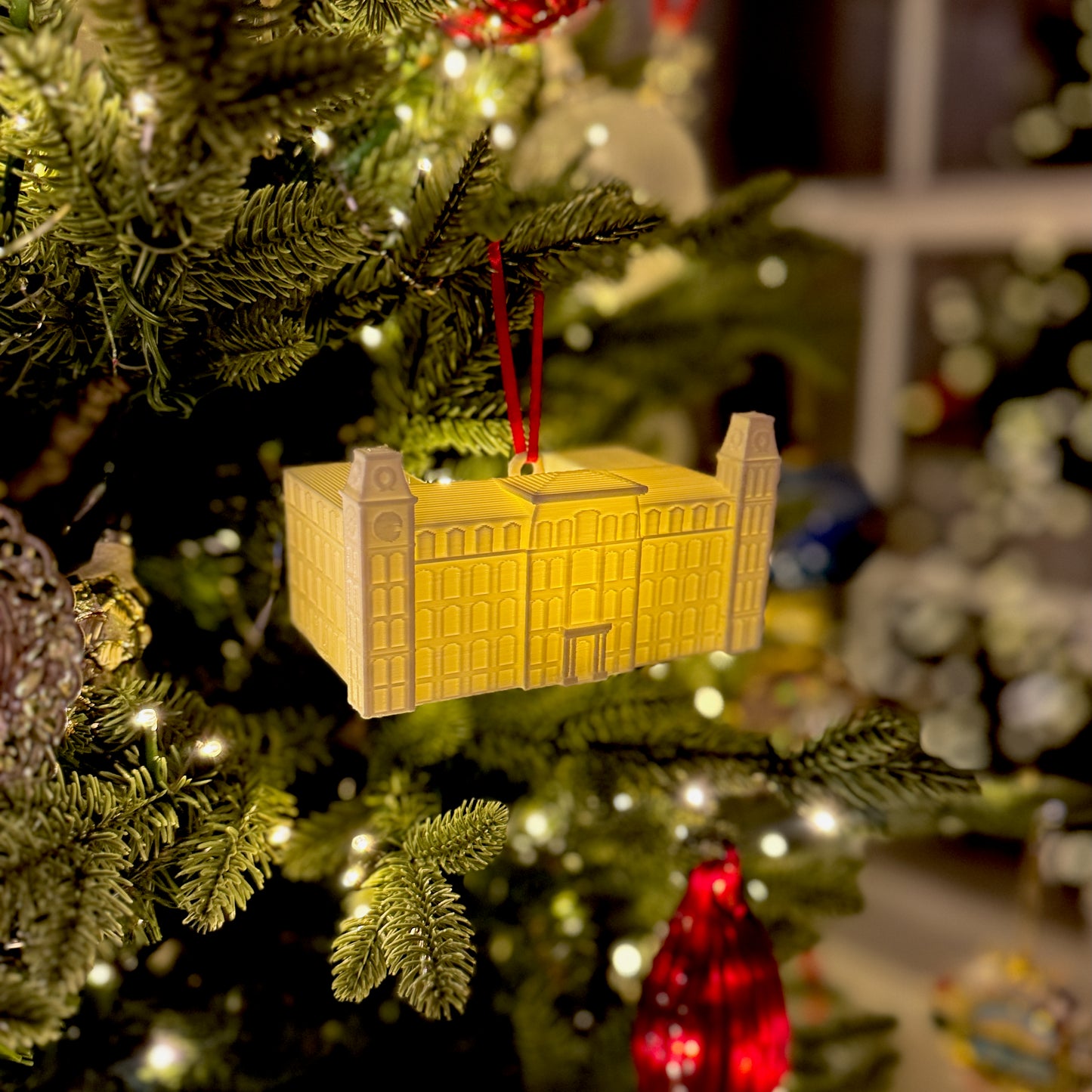 Side view of the University of Arkansas ornament depicting the Old Main building on campus.