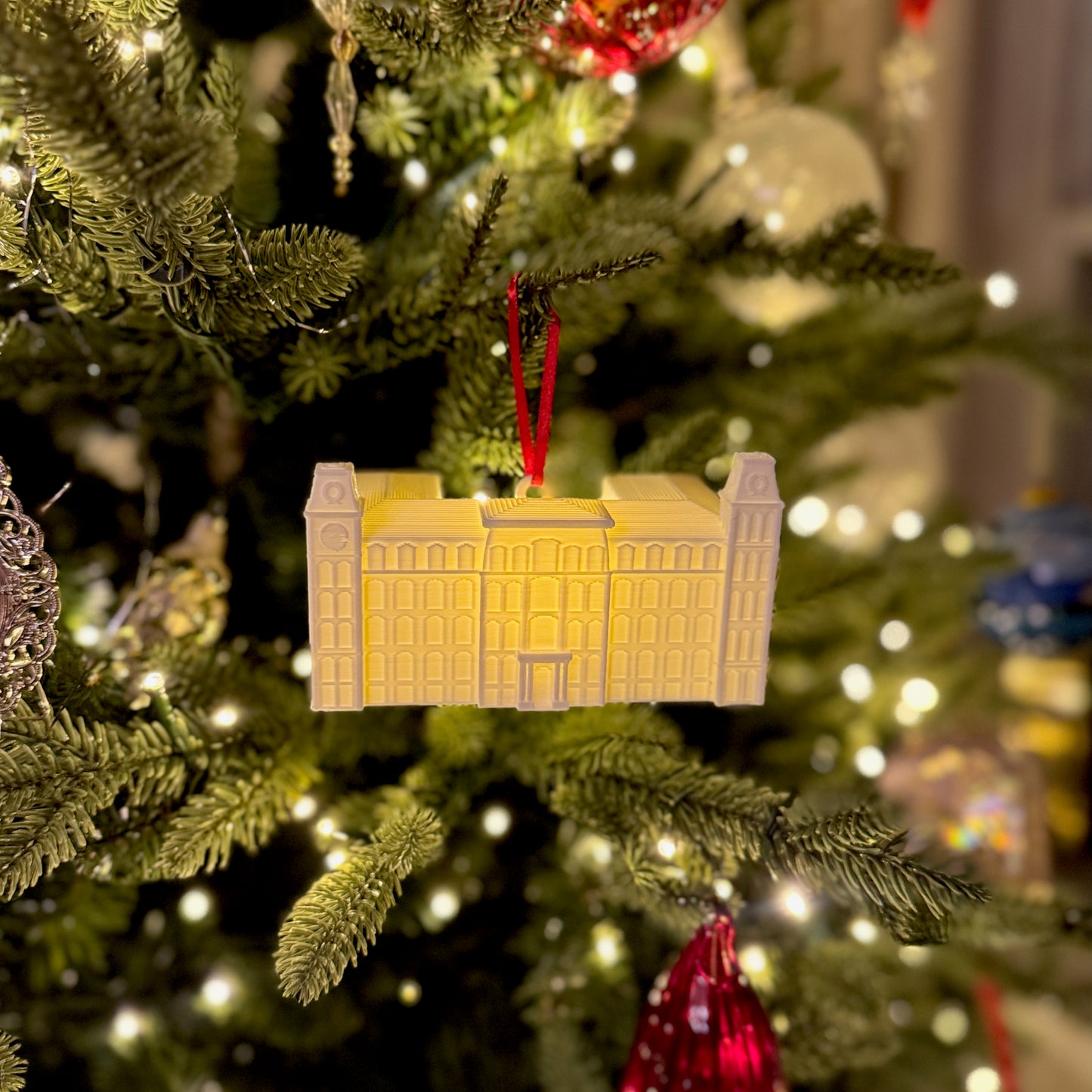 University of Arkansas Old Main ornament, shown on a Christmas tree.