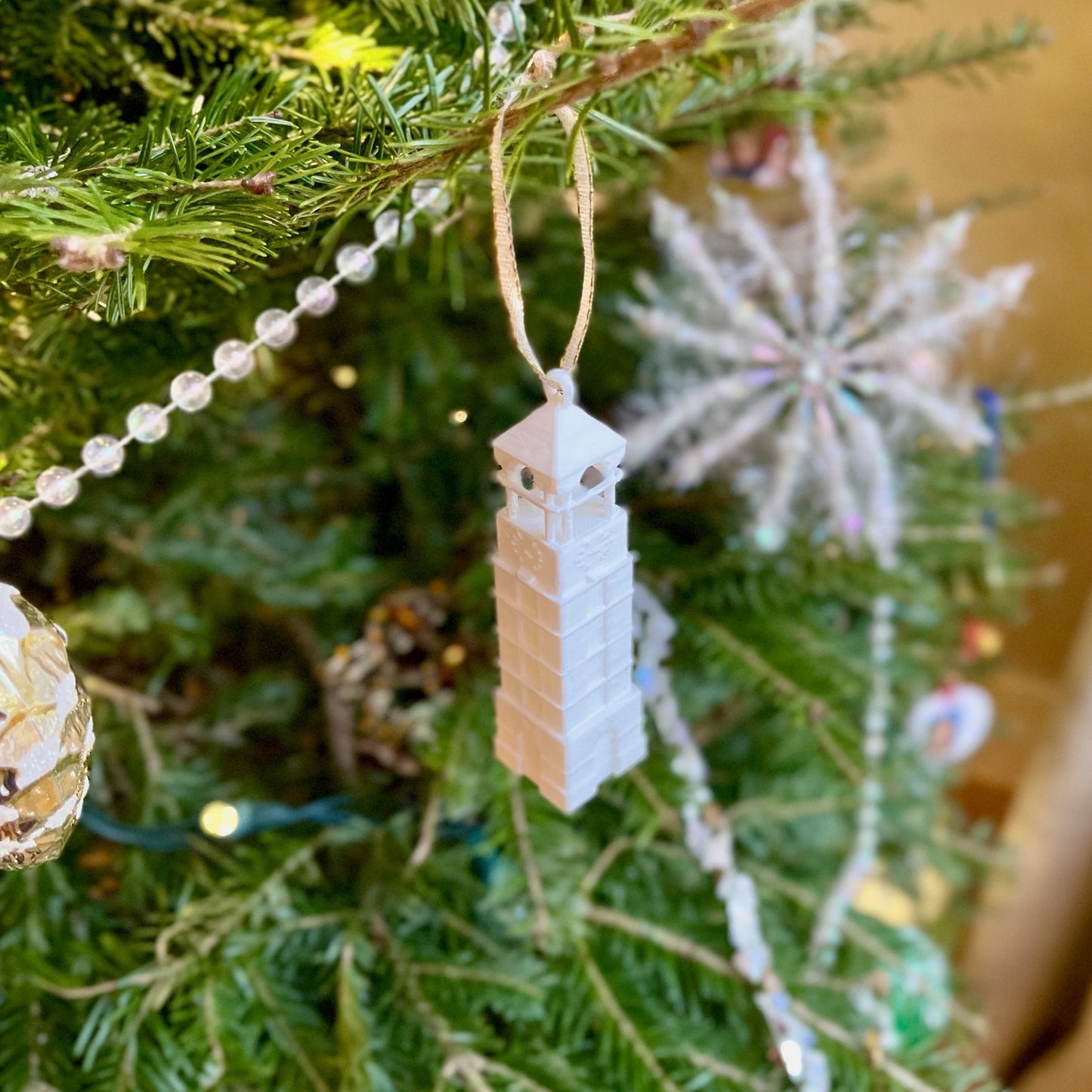 The Purdue Christmas decoration, shown on a Purdue tree.