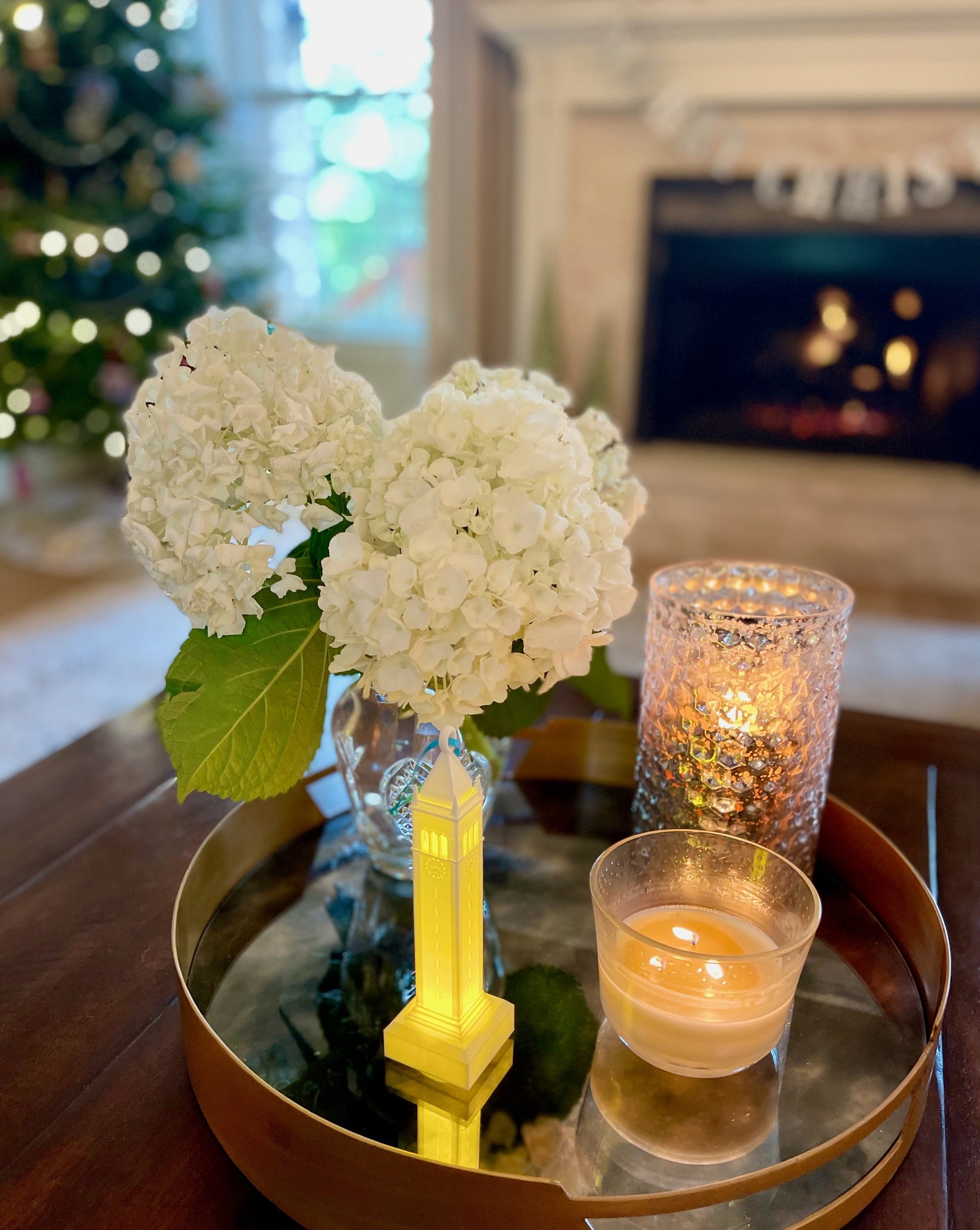 The Berkeley tower ornament, shown on a tray in a home decorated for Christmas.