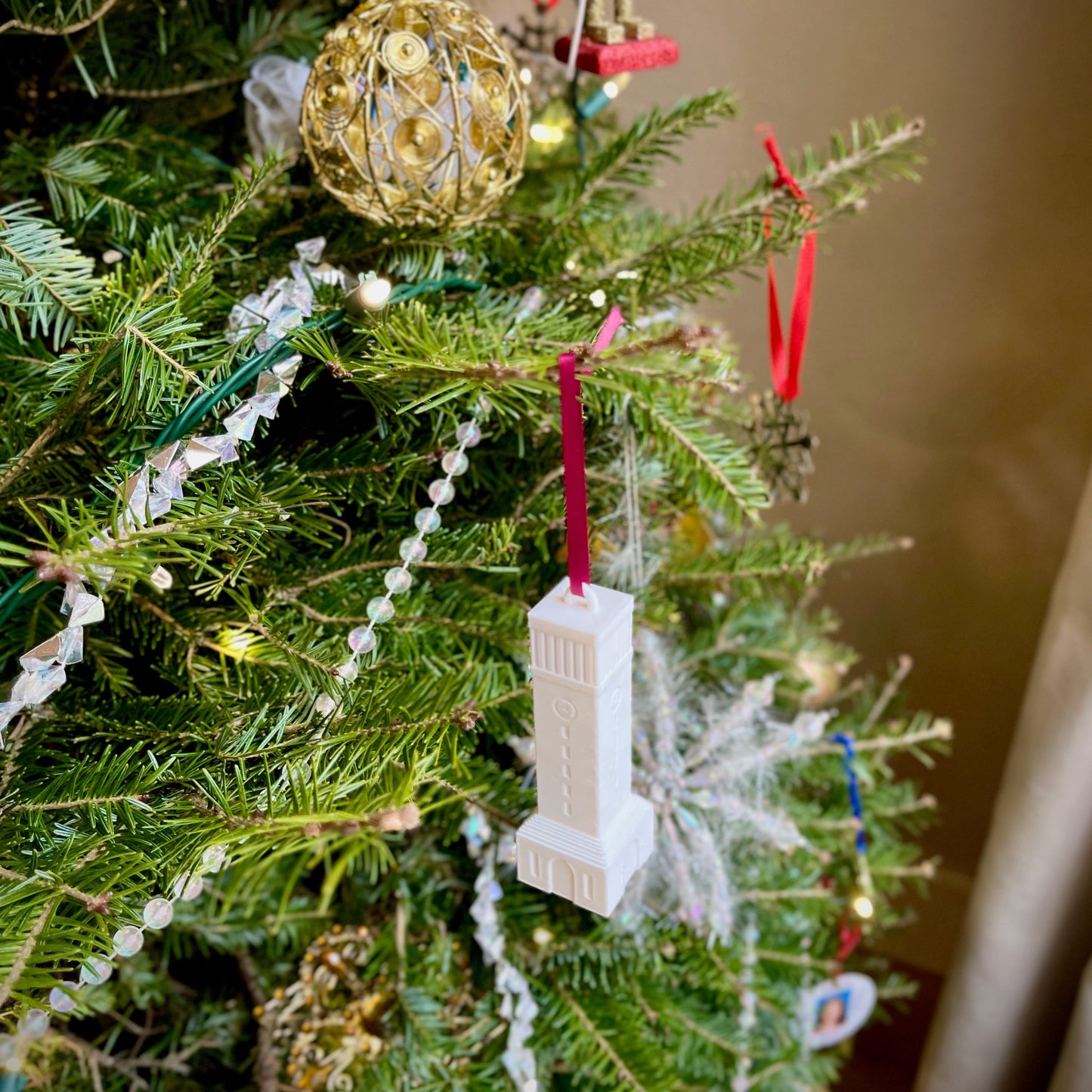 The Texas Aggie campus ornament, shown on a Christmas tree.