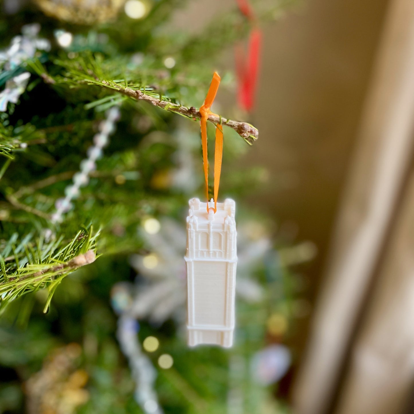 The University of Florida campus ornament, shown on a Christmas tree.