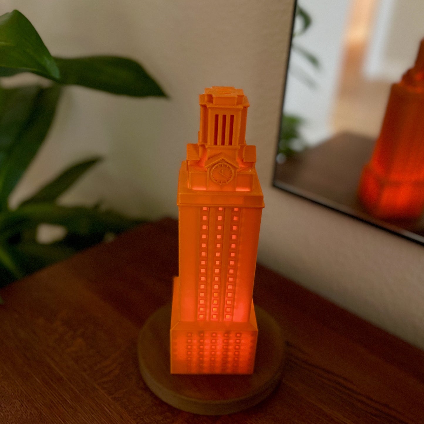 The burnt orange University of Texas lamp, shown on a side table.