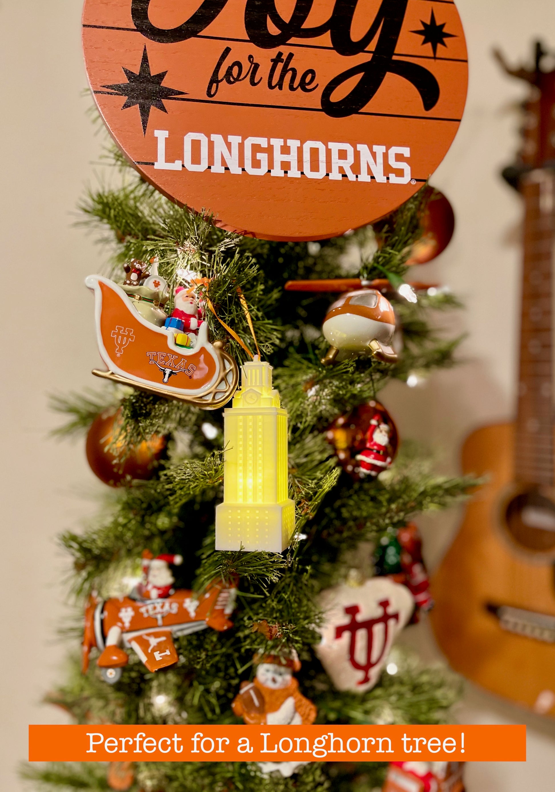 The UT Tower lighted ornament, shown on a University of Texas tree.