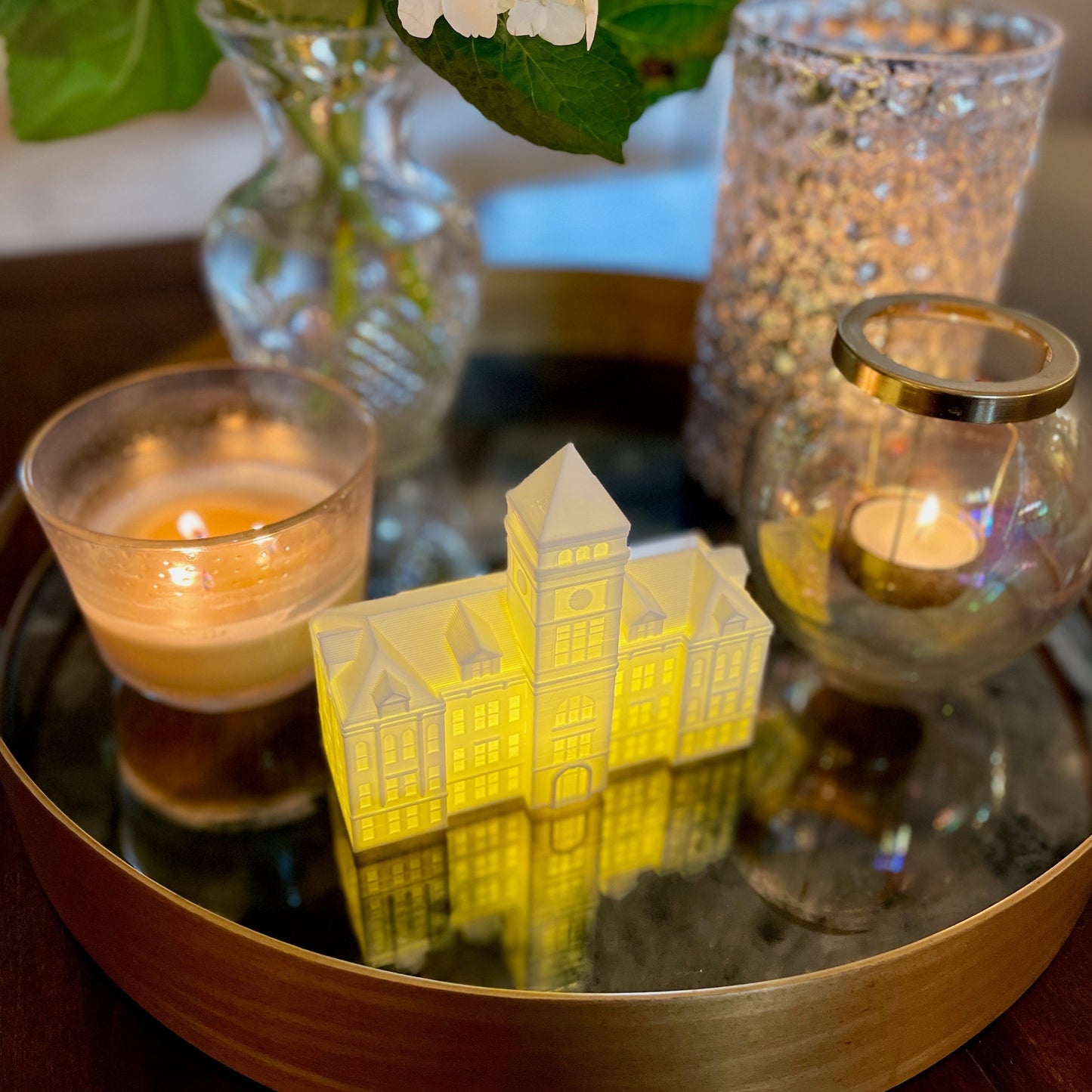 The lighted Clemson University figurine, shown on a living room tray.