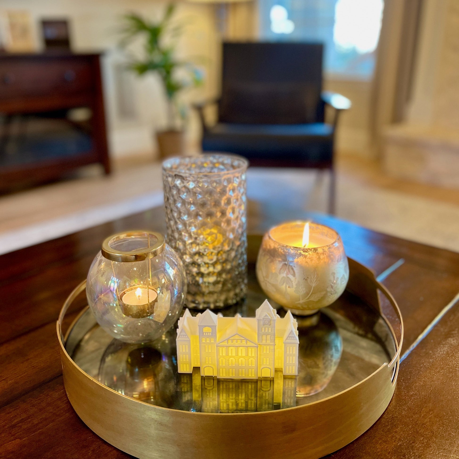 The Auburn figurine with light, shown on a tiered tray in a living room.