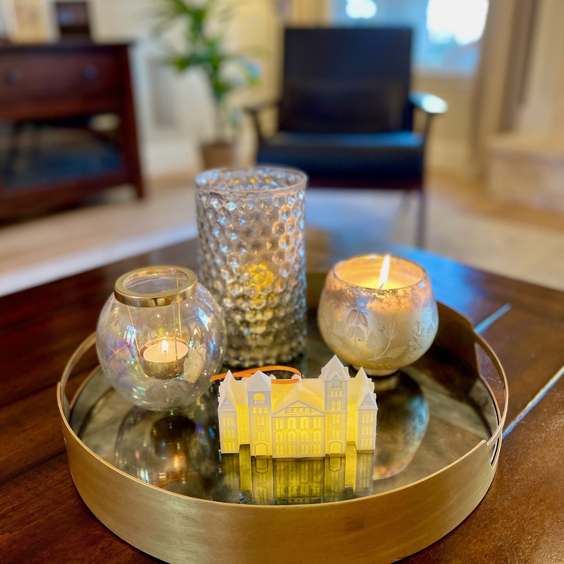 The Auburn ornament with light, shown on a living room tray.