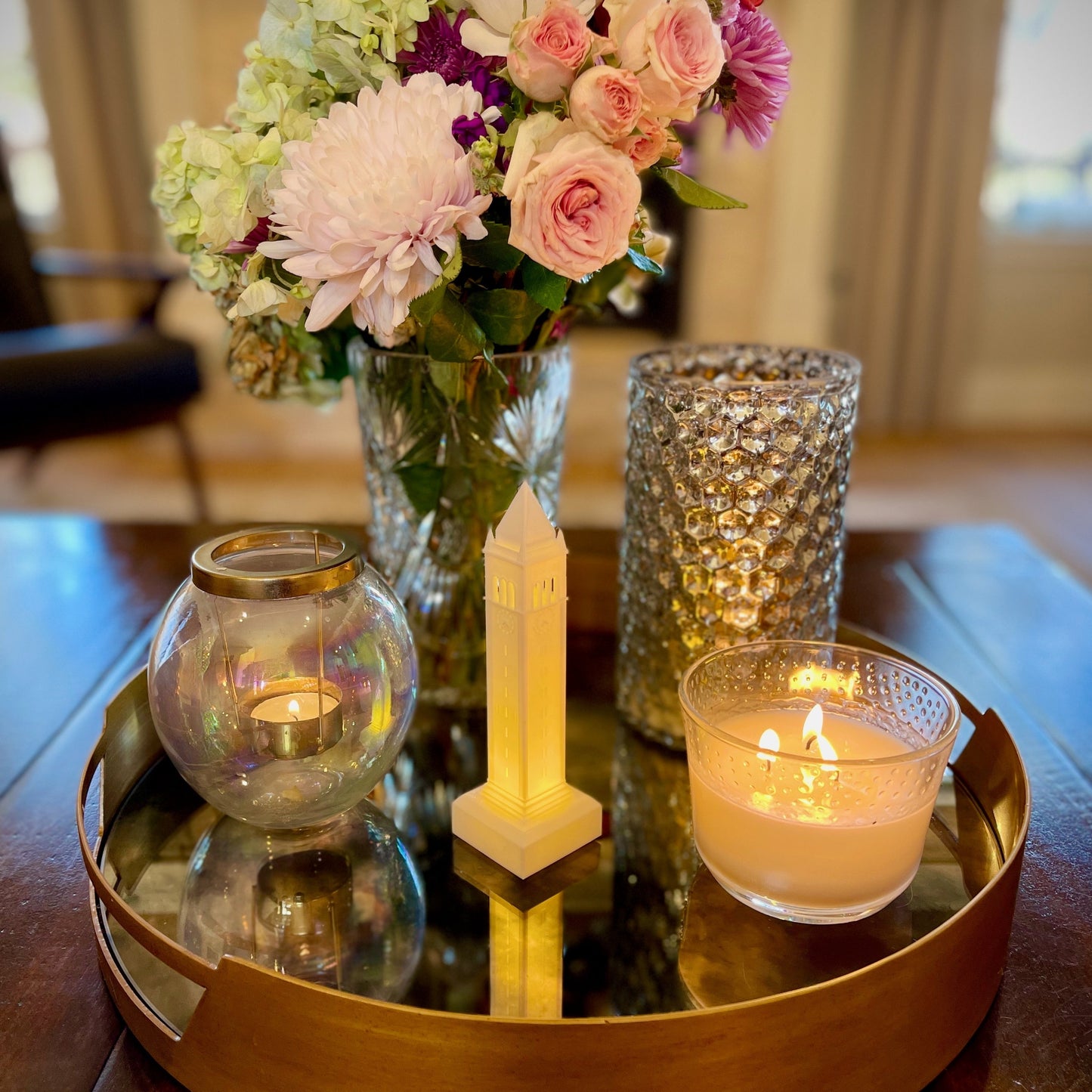 The Berkeley lighted figurine, shown styled on a living room tray.