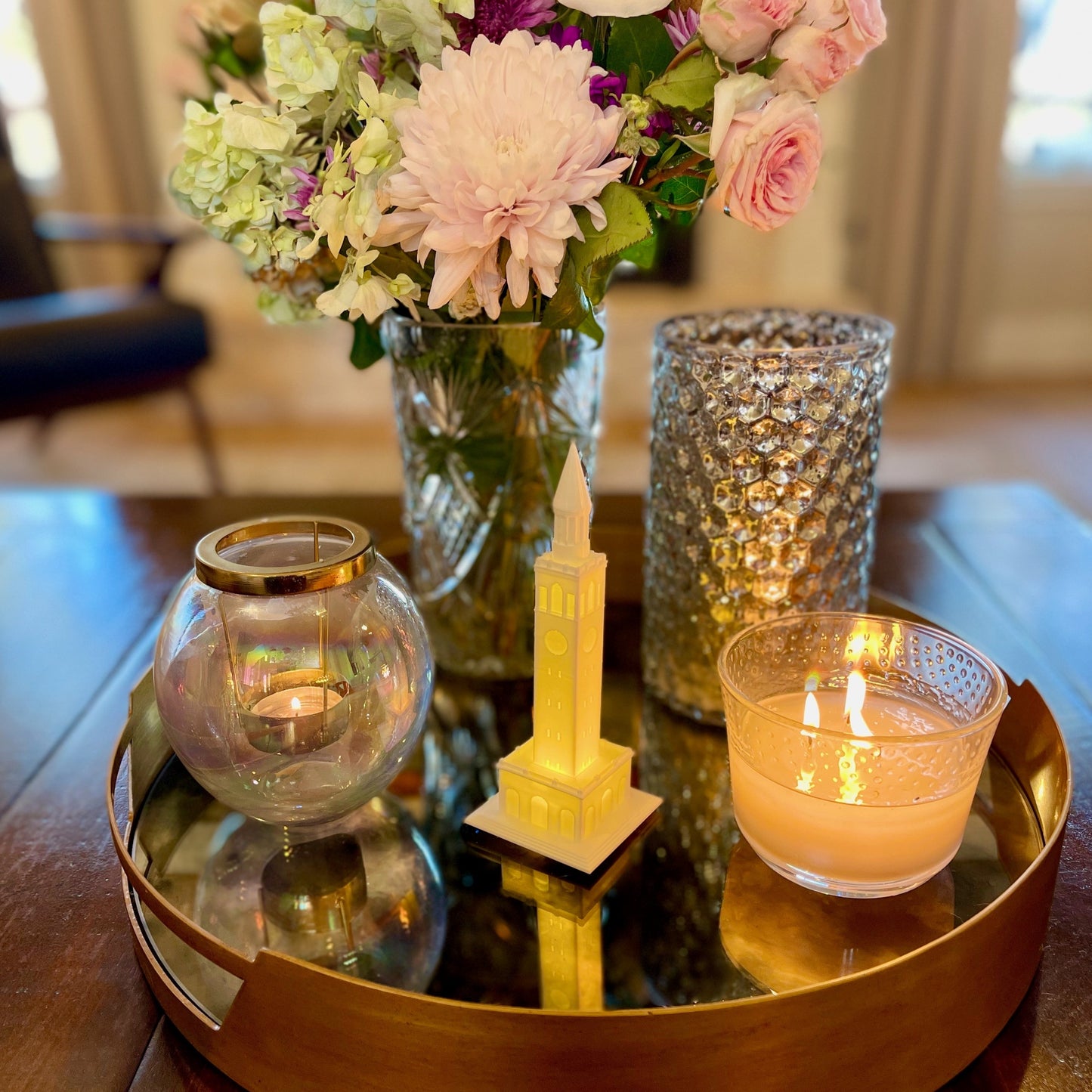 The UNC figurine with a light, shown styled on a living room tray.