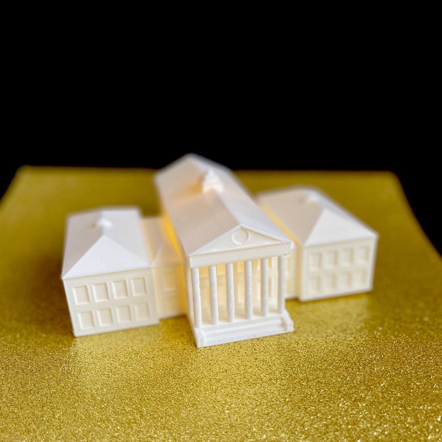 The Ole Miss campus figurine, designed to look like the Ole Miss Lyceum.