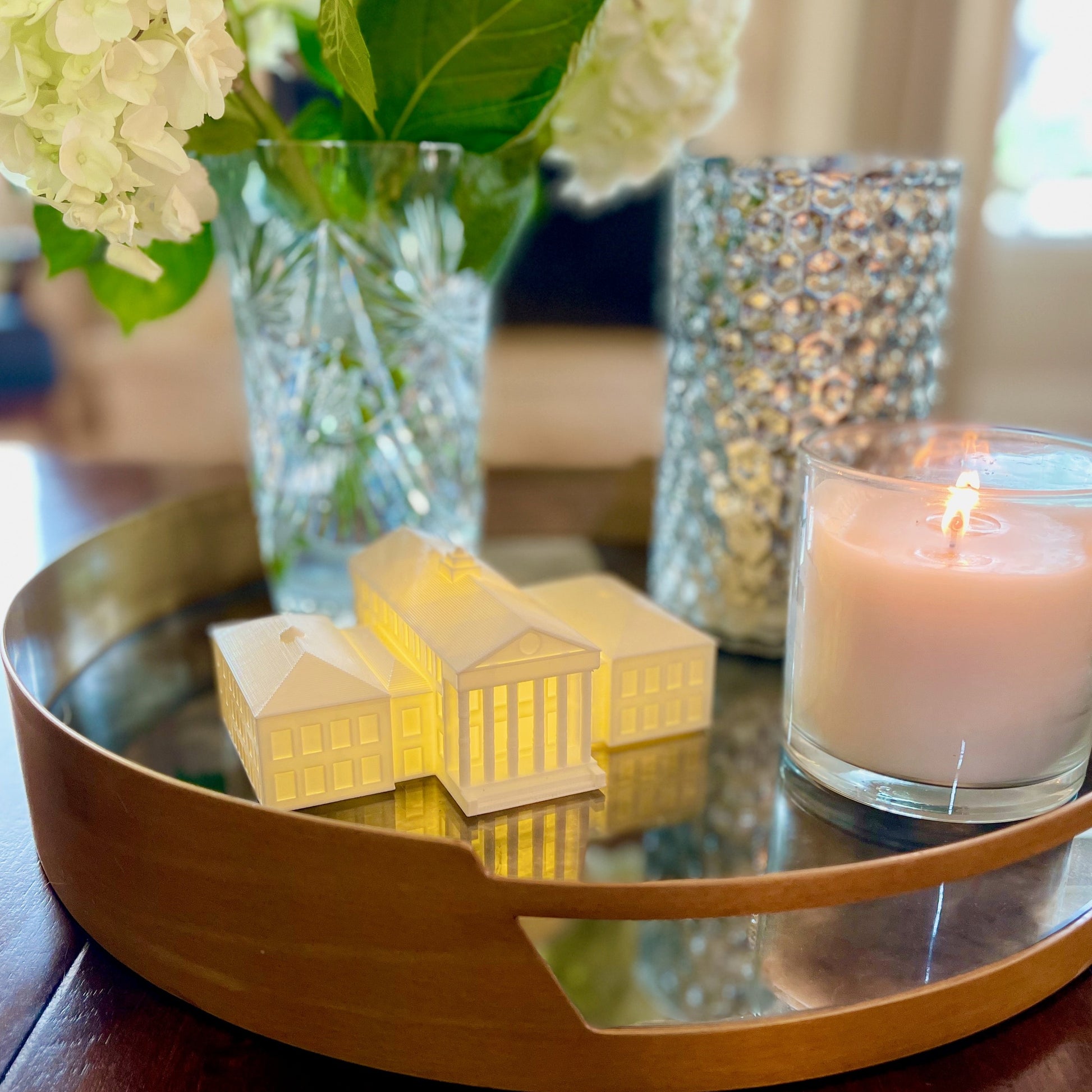 The Ole Miss Lyceum lighted figurine, shown on a living room tray.