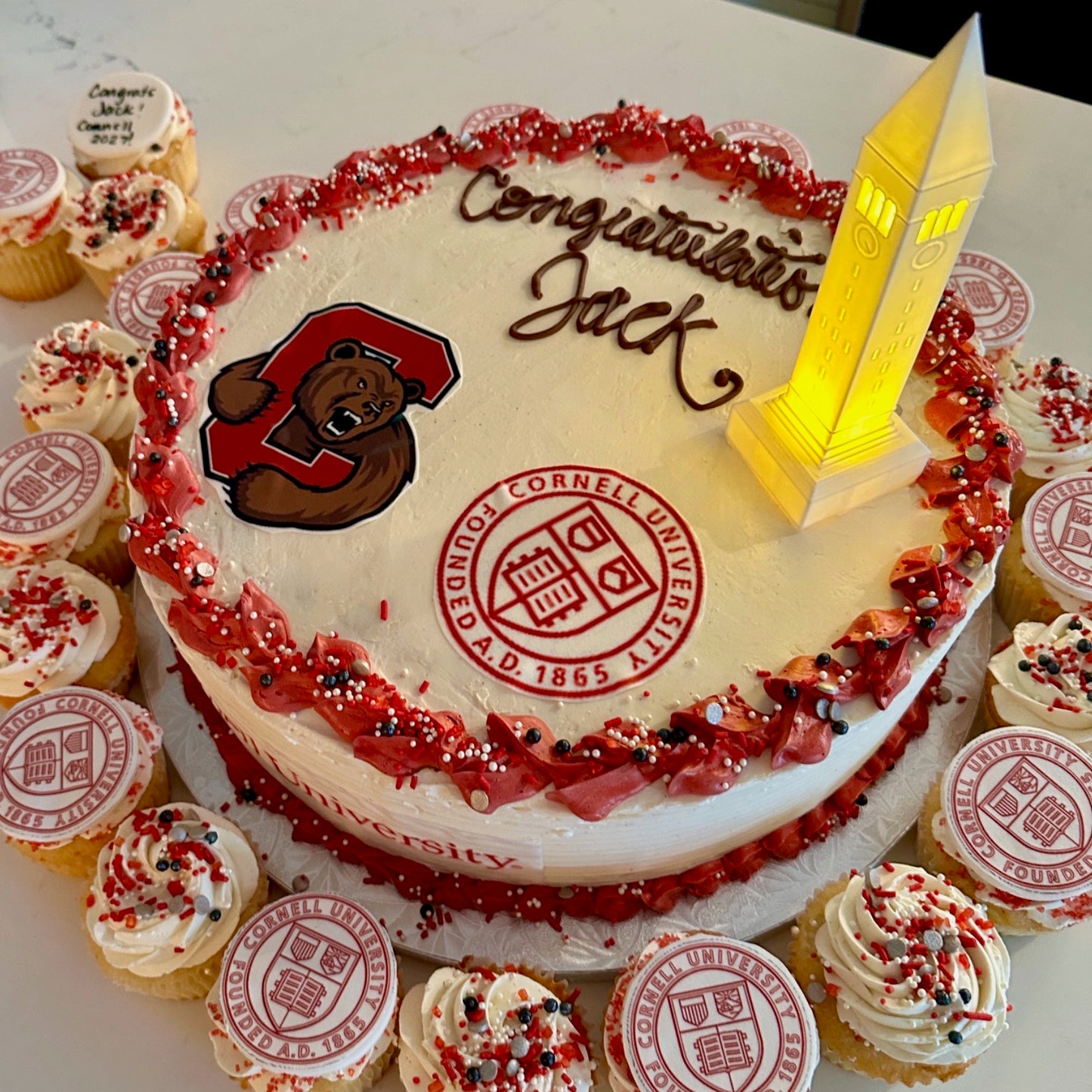 The Cornell cake topper, shown on a cake for a Cornell graduate.