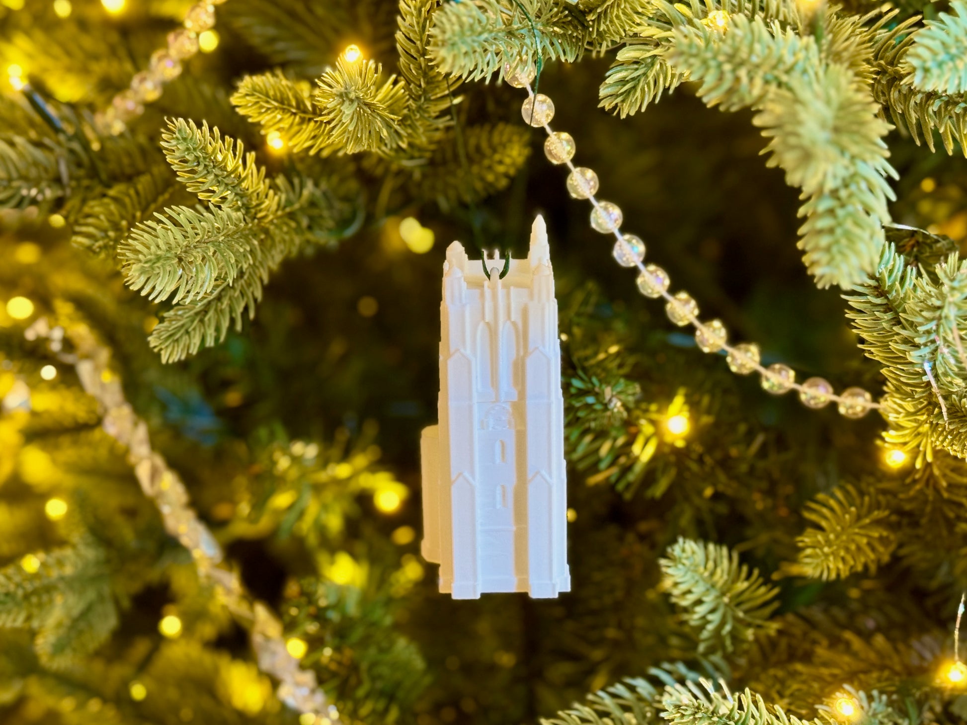 Michigan State Spartans ornament shown on a tree.