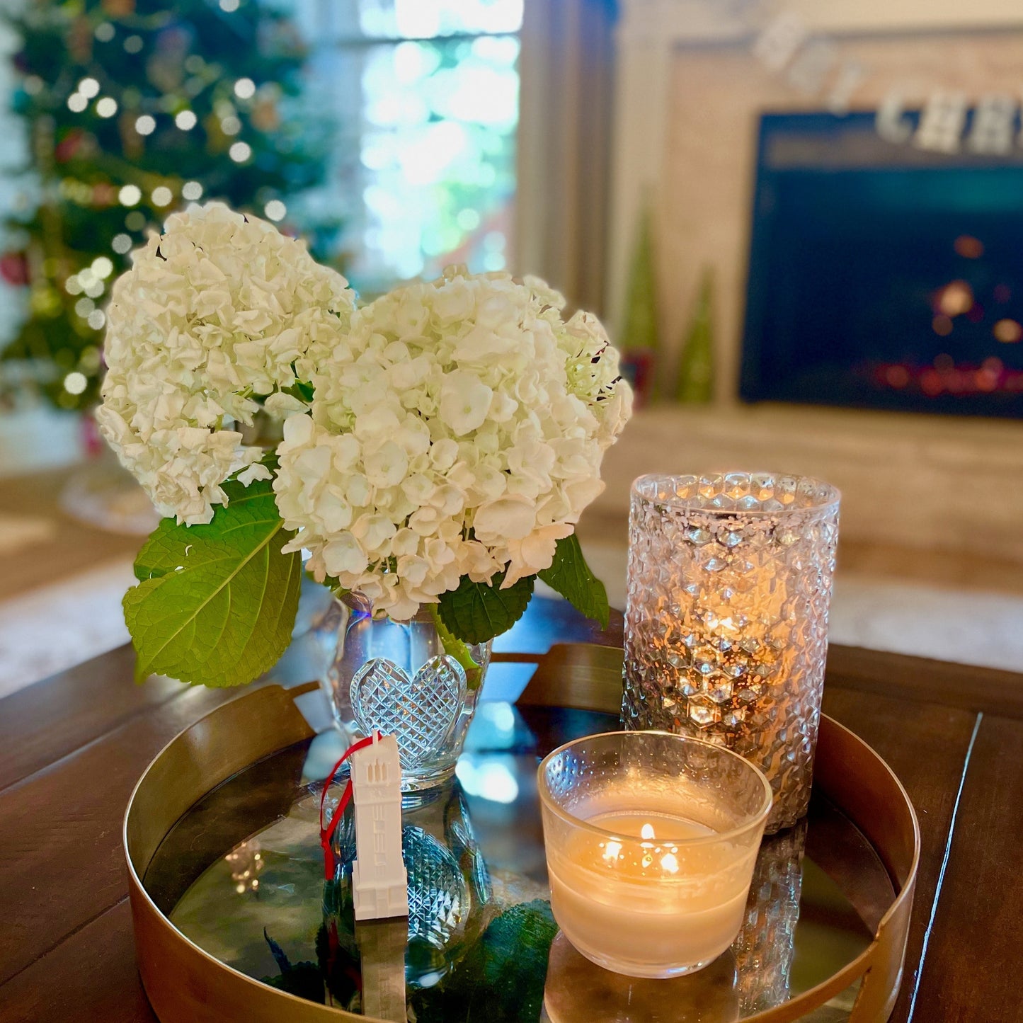 The NC State Christmas ornament, shown in a home decorated for the Holidays.