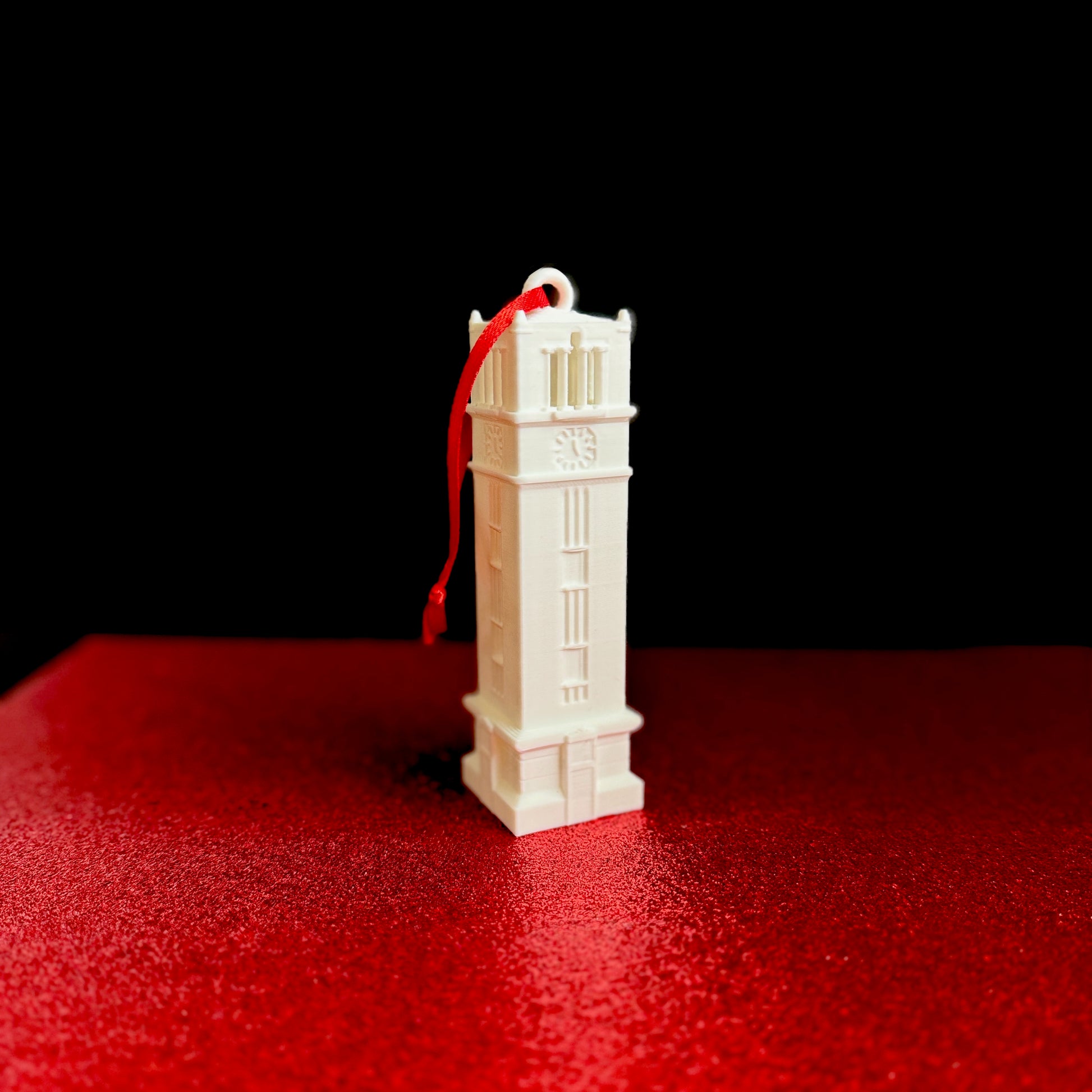 Closeup view of the NC State Bell Tower ornament.