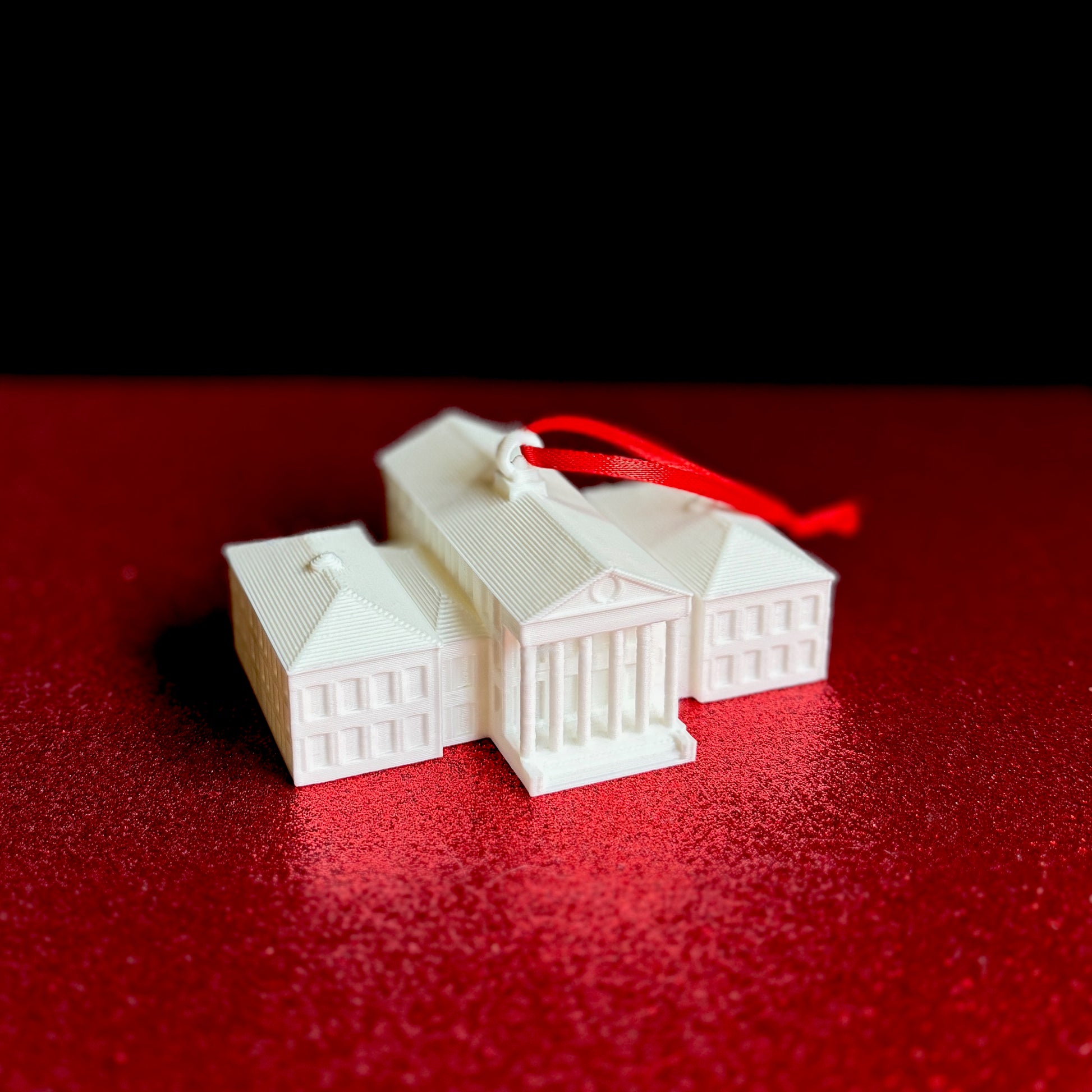 The Ole Miss college ornament, designed as a replica of the Lyceum building on the Oxford campus.