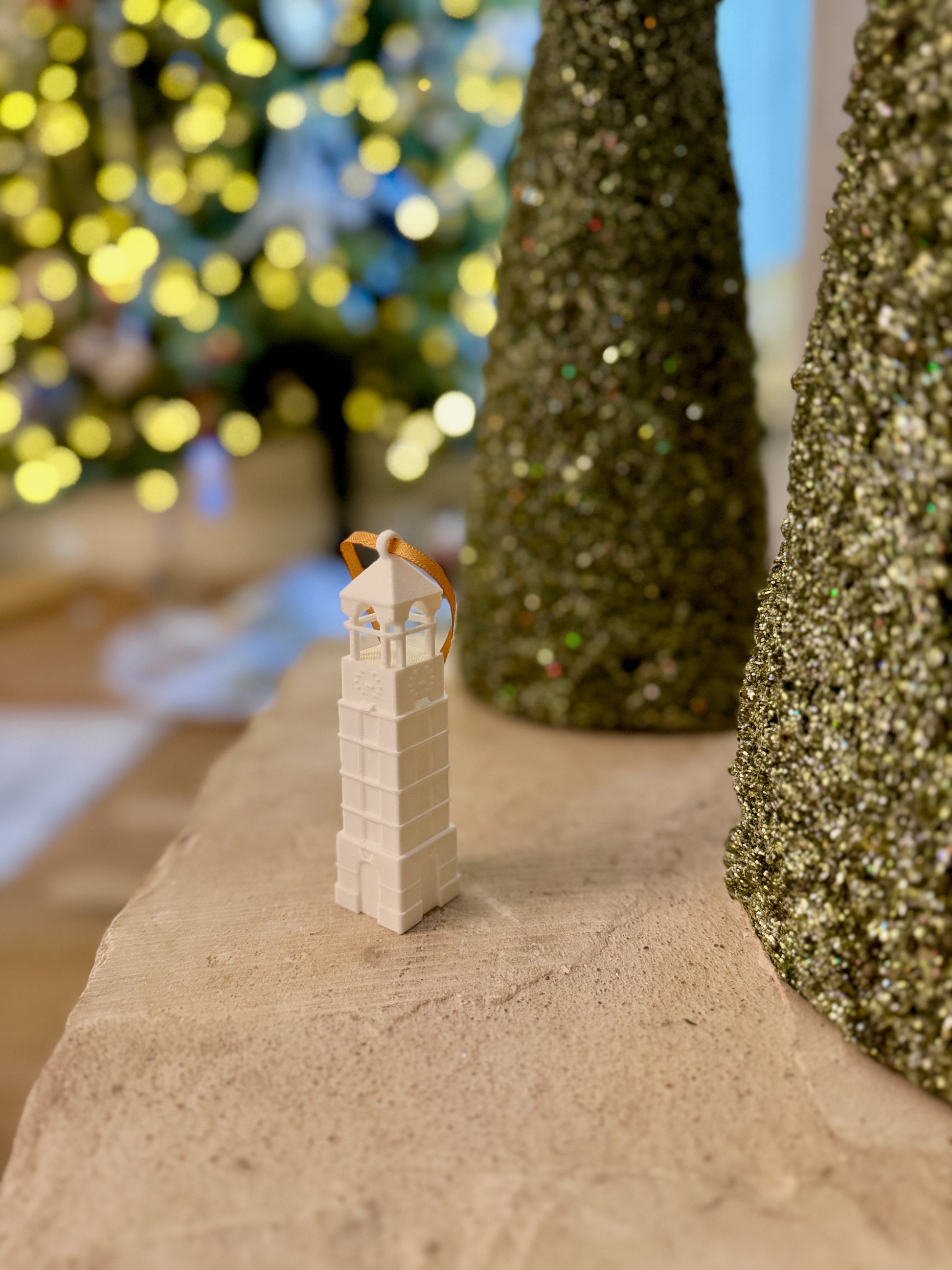 Purdue keepsake ornament of the bell tower, shown in a home decorated for the Holidays.