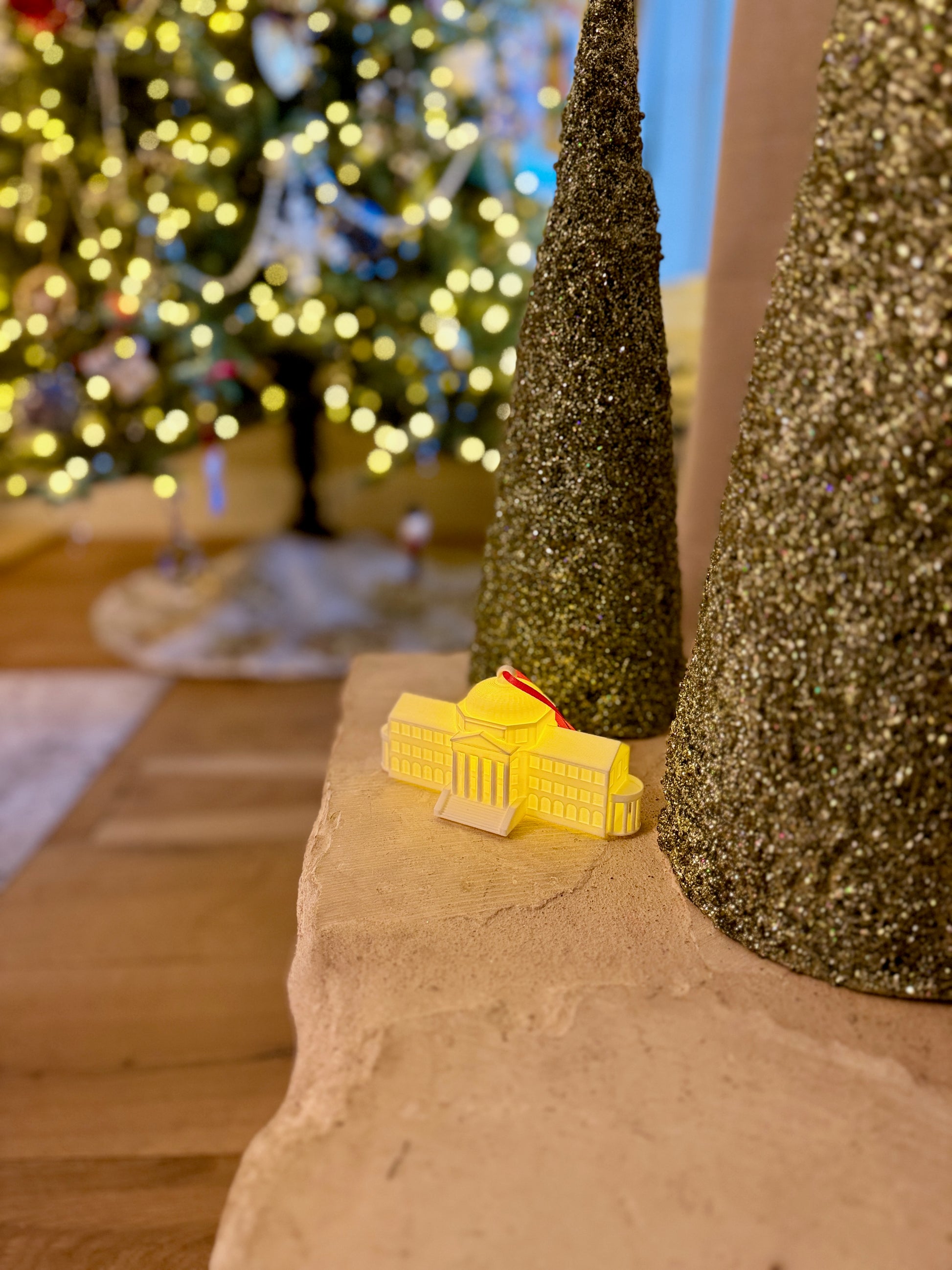 The SMU alumni ornament shown in a home decorated for Christmas.