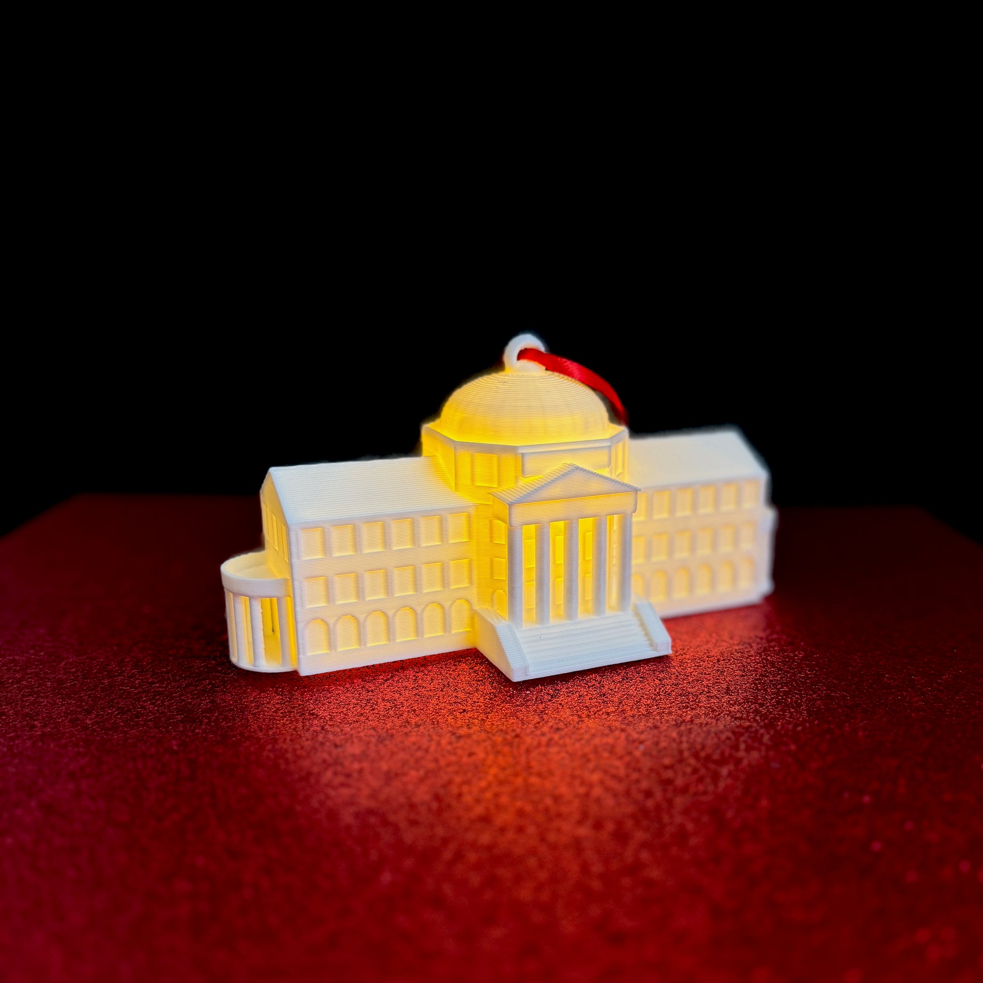 Side view of the SMU Christmas ornament featuring Dallas Hall.