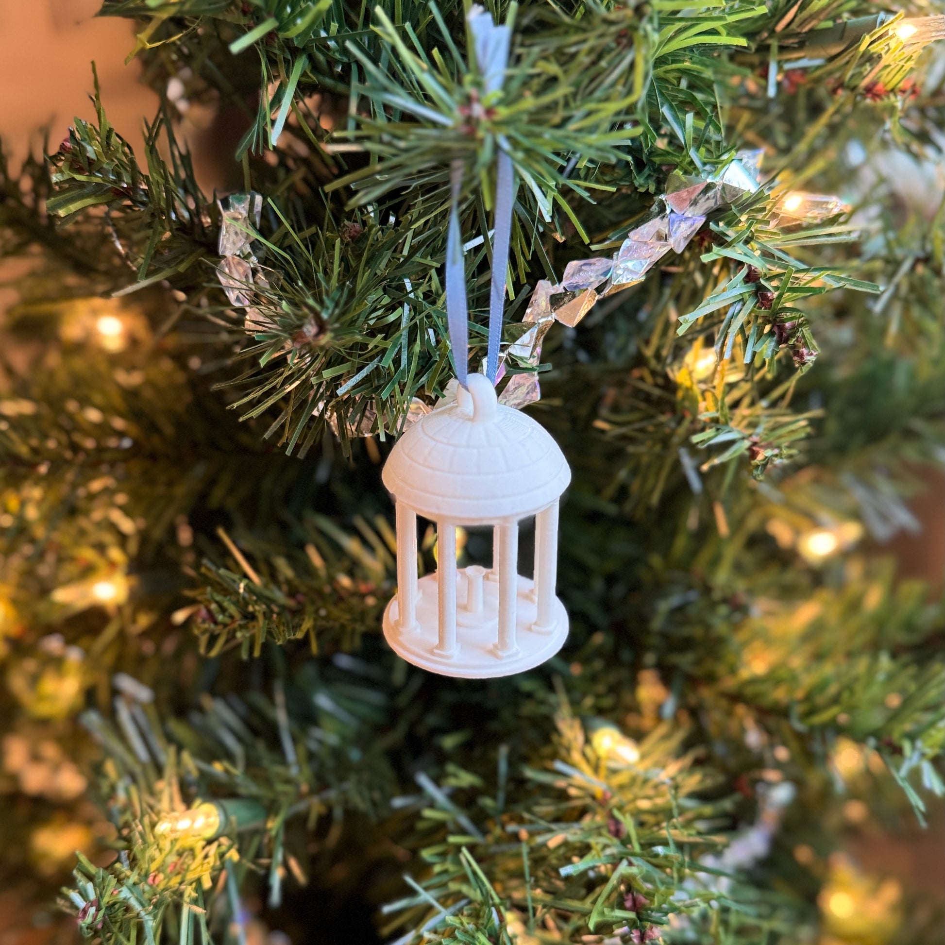 The UNC Chapel Hill Ornament on a Christmas tree.