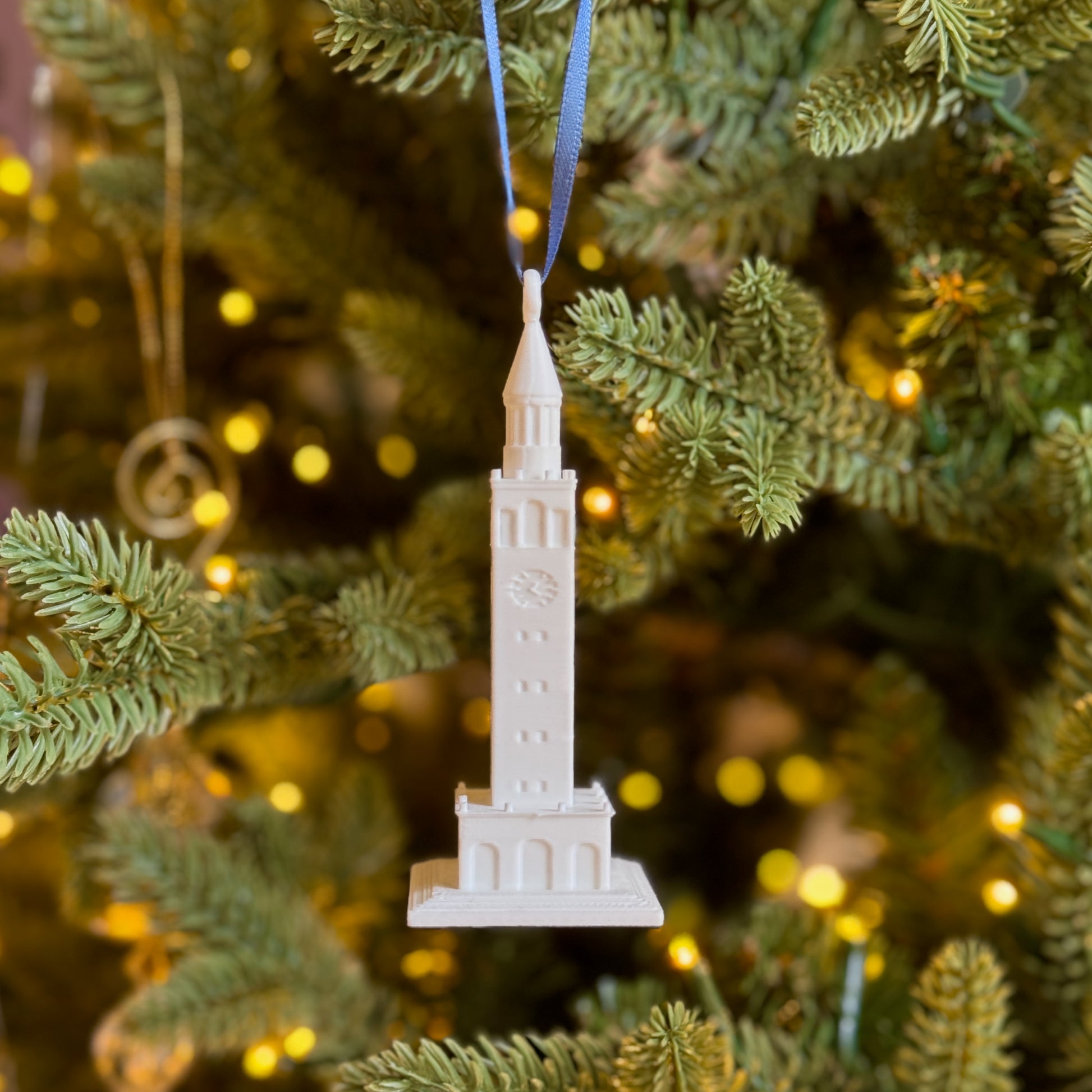 The UNC Bell Tower ornament, shown on a Christmas tree.