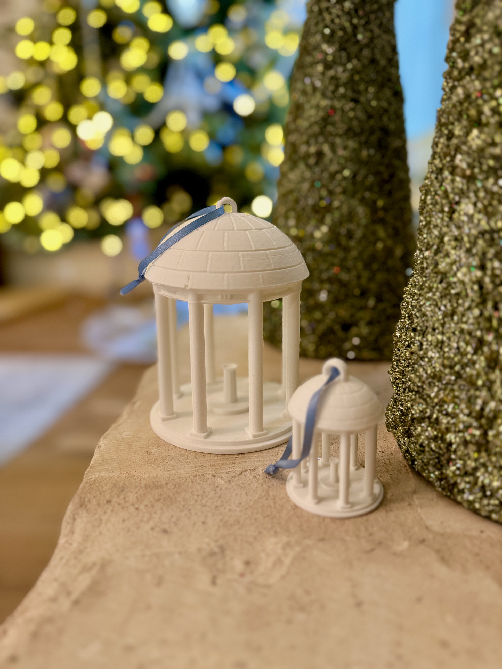 The UNC student ornaments designed as the Old Well and shown in a home decorated for the Holidays.