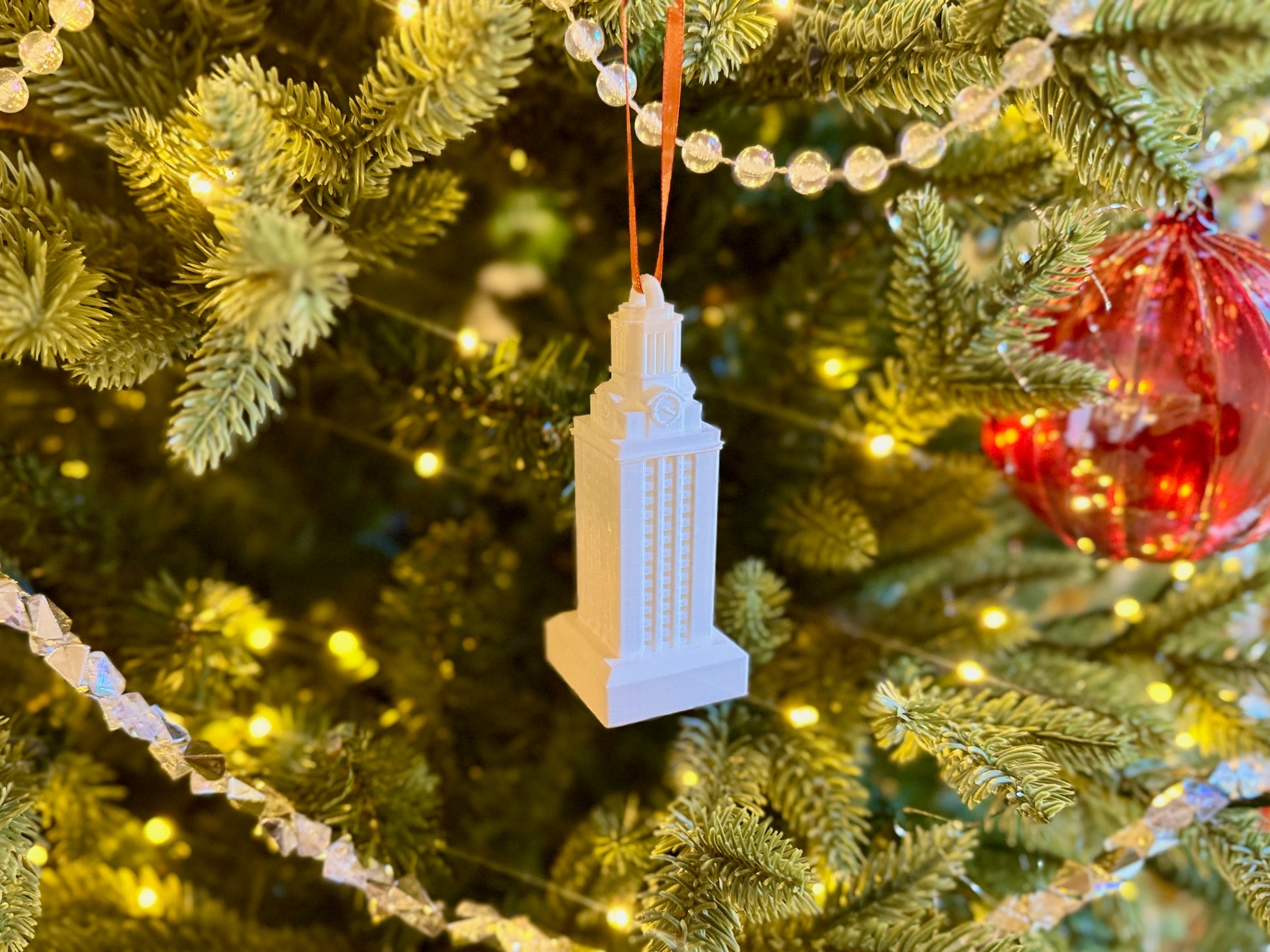 The UT Tower ornament, shown in white.