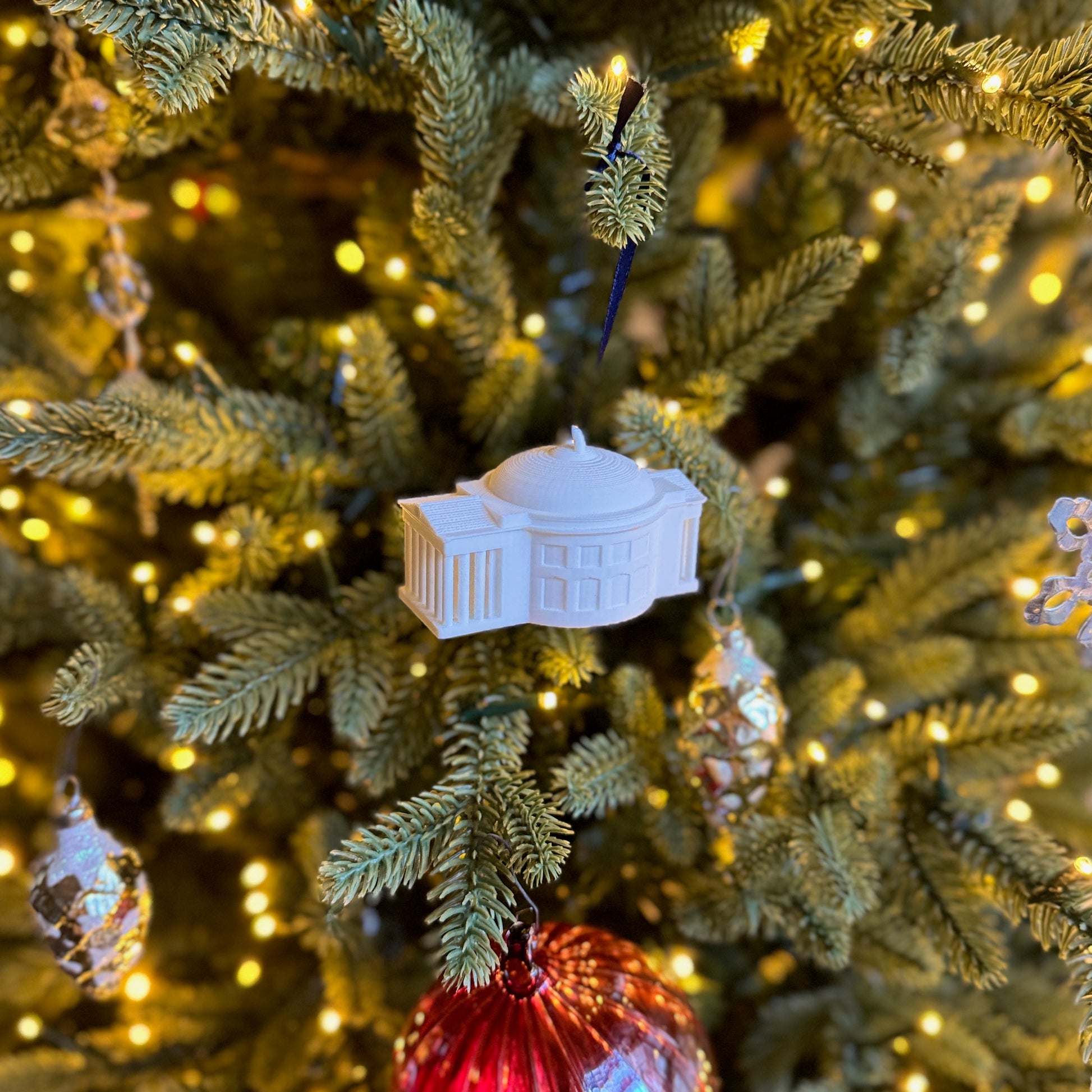 The UVA college ornament, shown on a UVA tree.