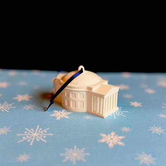 The UVA Rotunda ornament, shown against a blue holiday background.