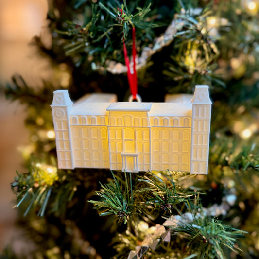 The Unviersity of Arkansas Old Main ornament on a Christmas tree.