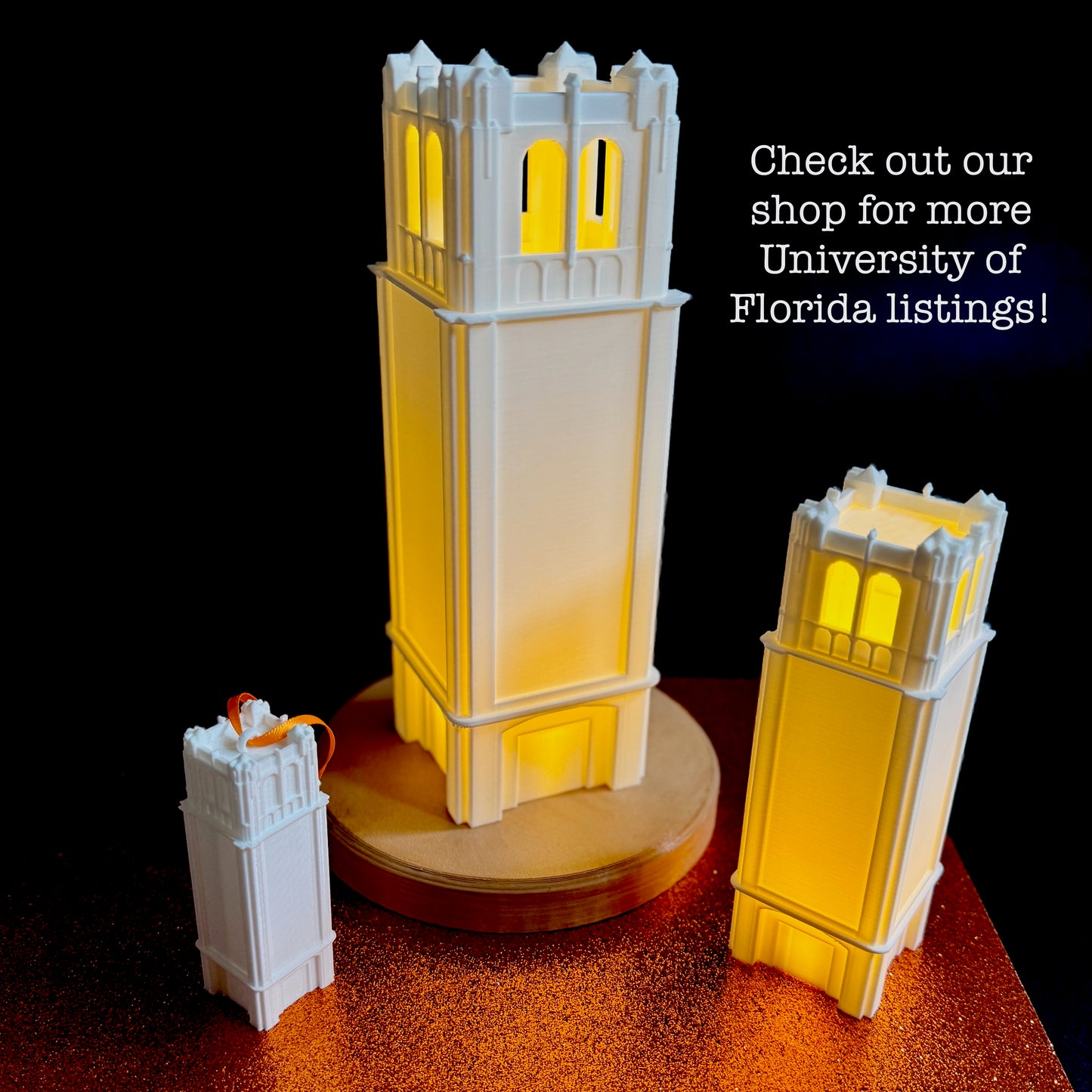 The University of Florida Century Tower figurine, light, and ornament, shown together.