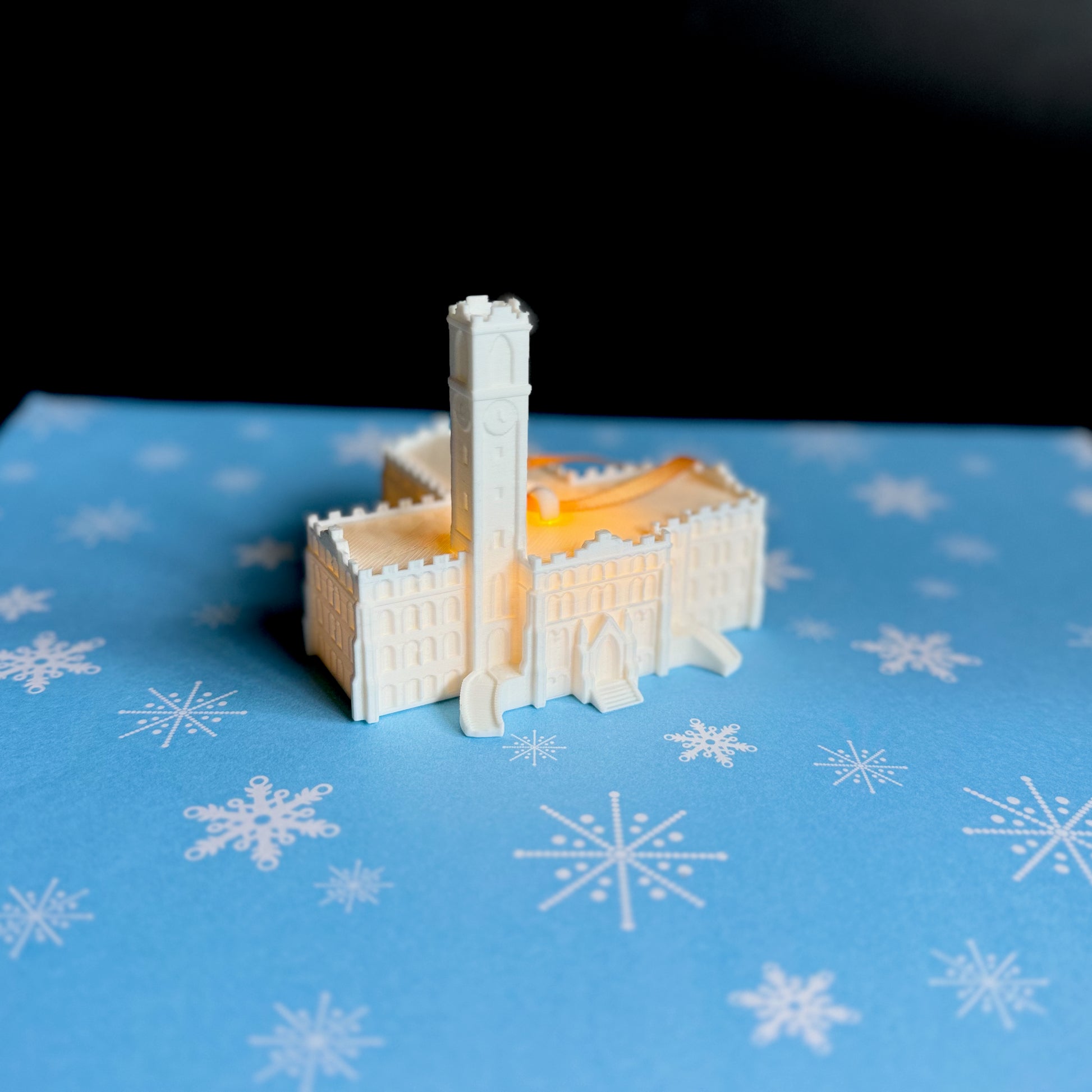 The holiday decoration for Vanderbilt University, shown against a Christmas background.