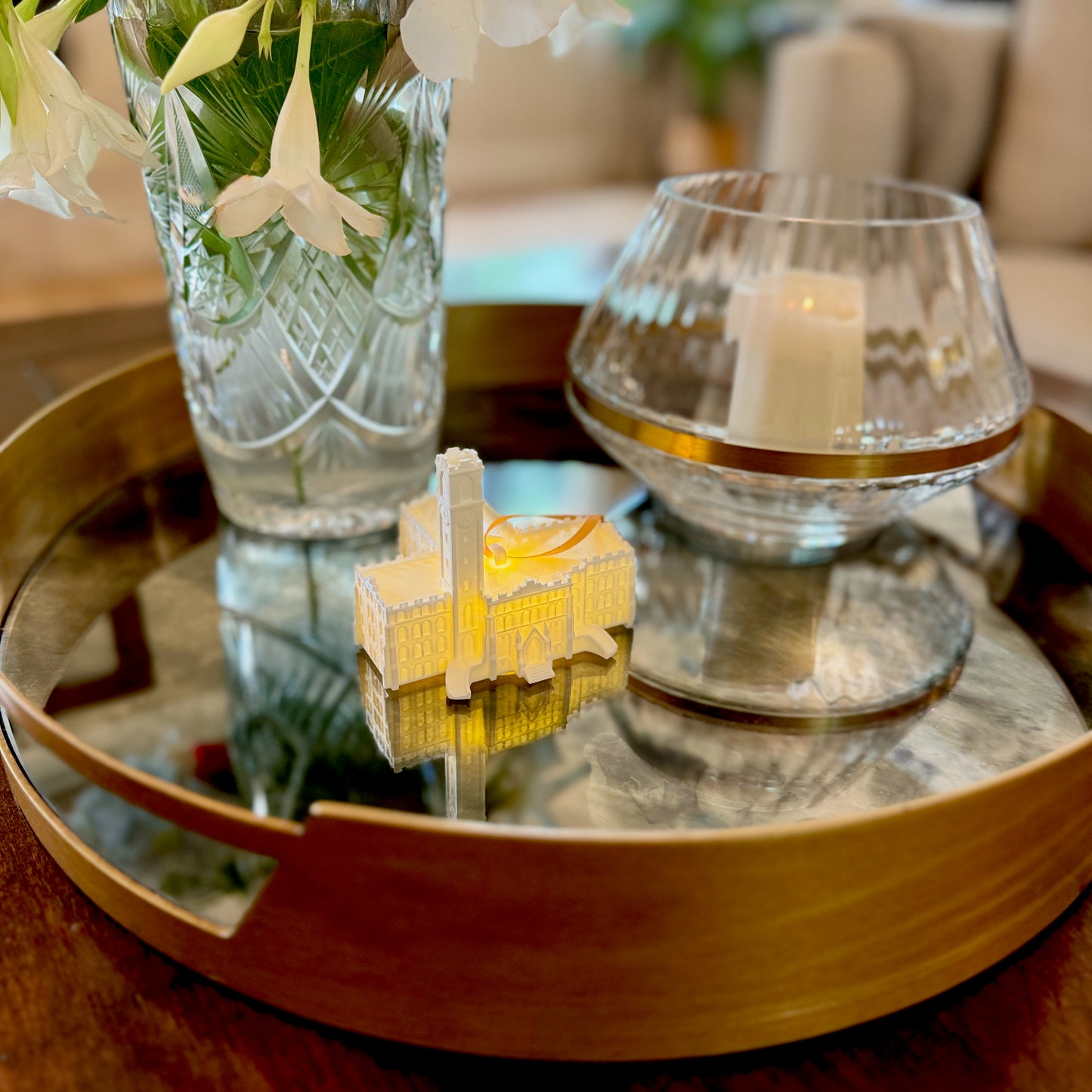 The Vanderbilt student ornament shown on a living room tray.