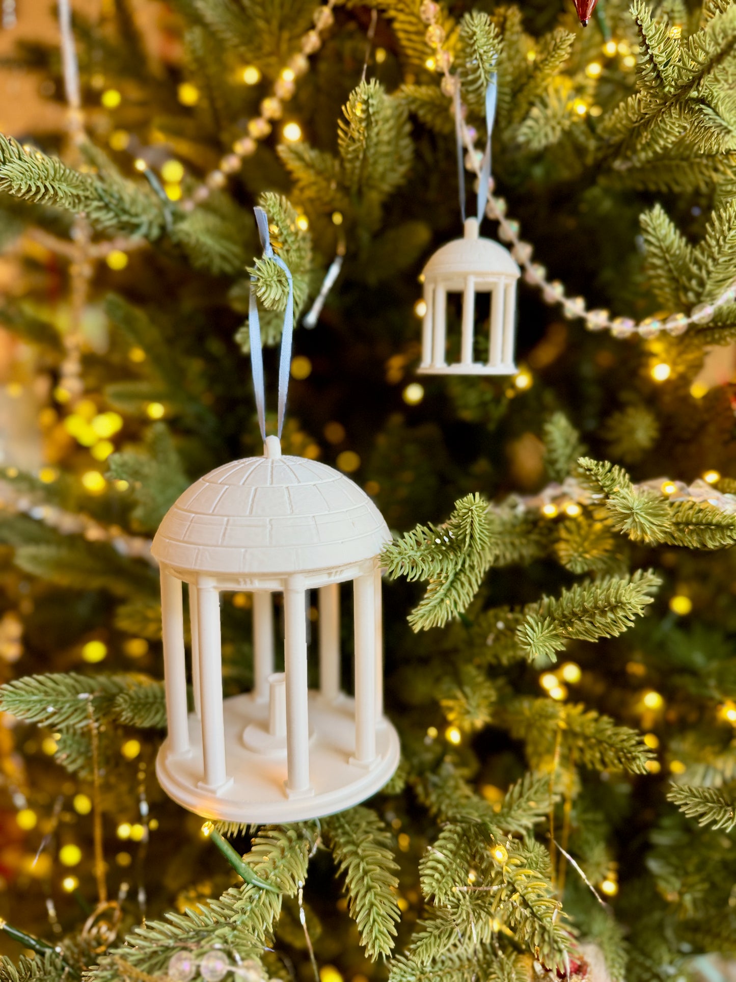 The college ornament for UNC, designed as the Old Well.
