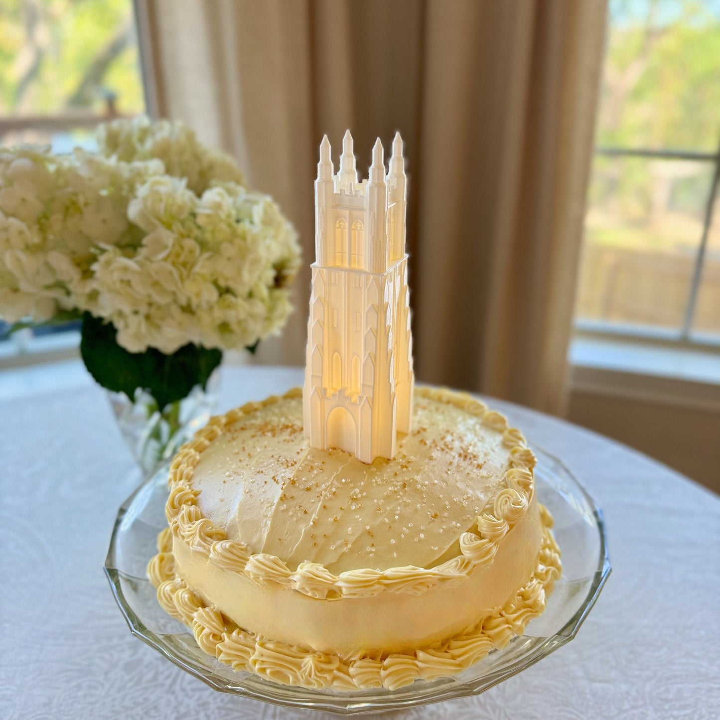 The Duke Chapel light, shown in use as a cake topper on a Duke graduation cake.