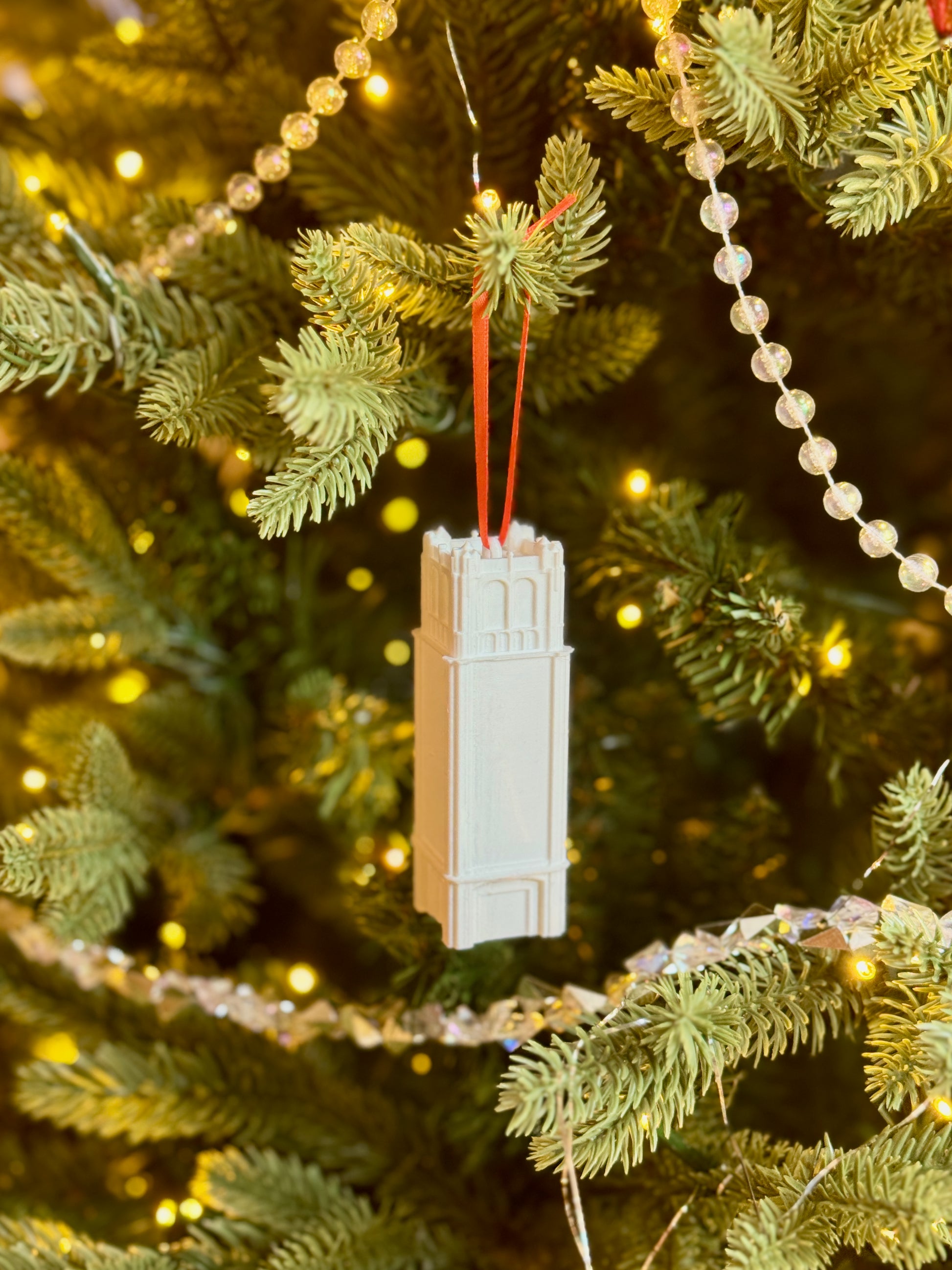 The University of Florida alumni ornament designed as the Century Tower building.