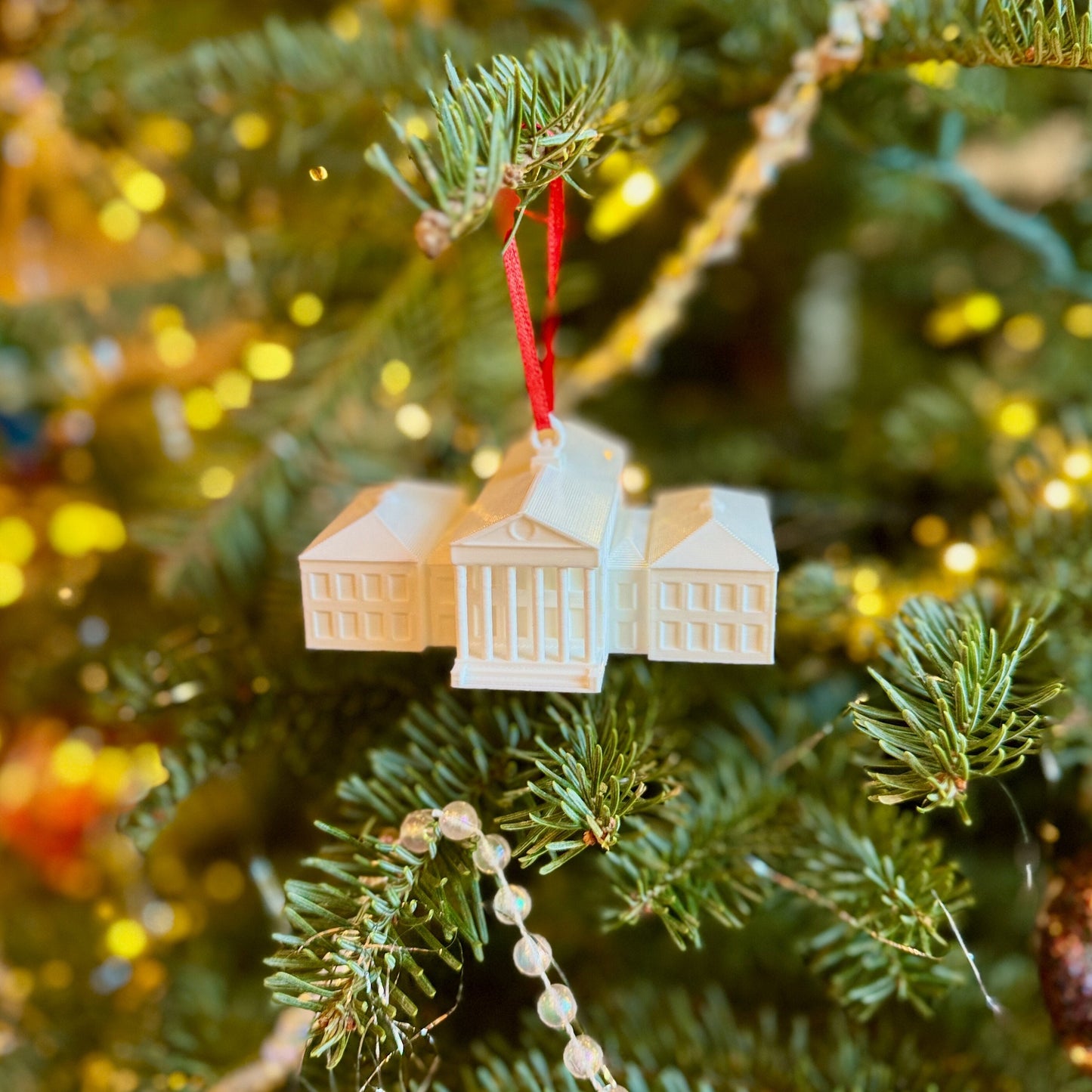 The Ole Miss Christmas ornament, designed as a replica of the Ole Miss Lyceum.