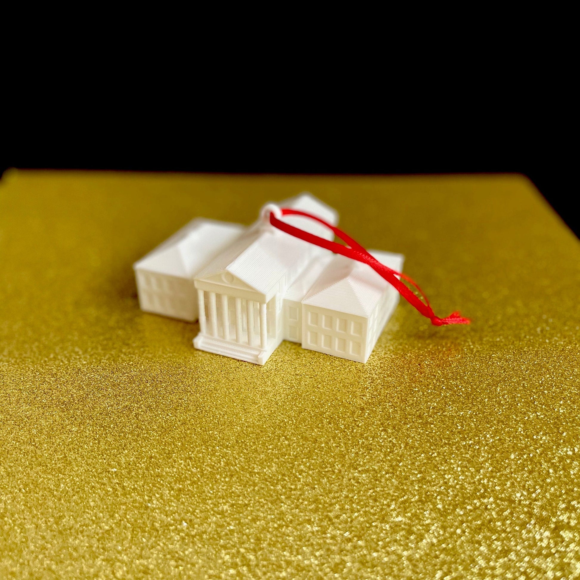 The 3D printed Ole Miss ornament, designed as a replica of the Ole Miss Lyceum campus ornament.