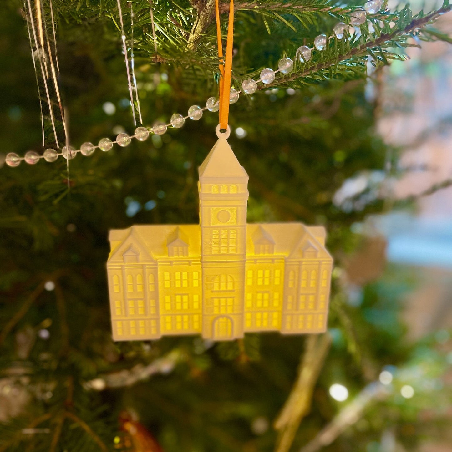 The Clemson lighted ornament, shown on a Christmas tree.