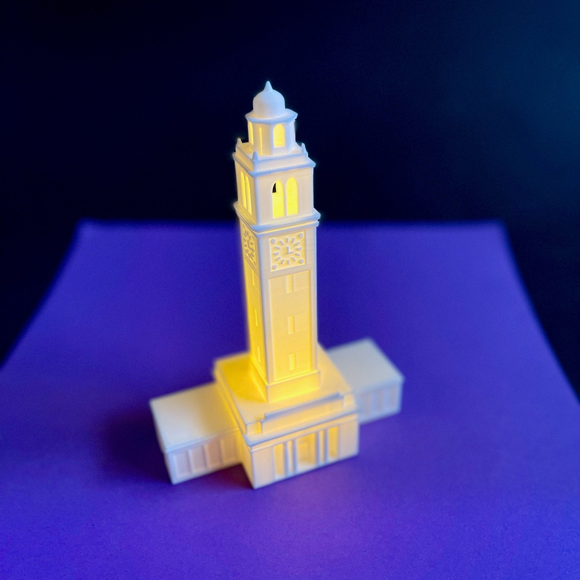 The LSU night light, designed in honor of the LSU Memorial Tower, and shown against a purple background.