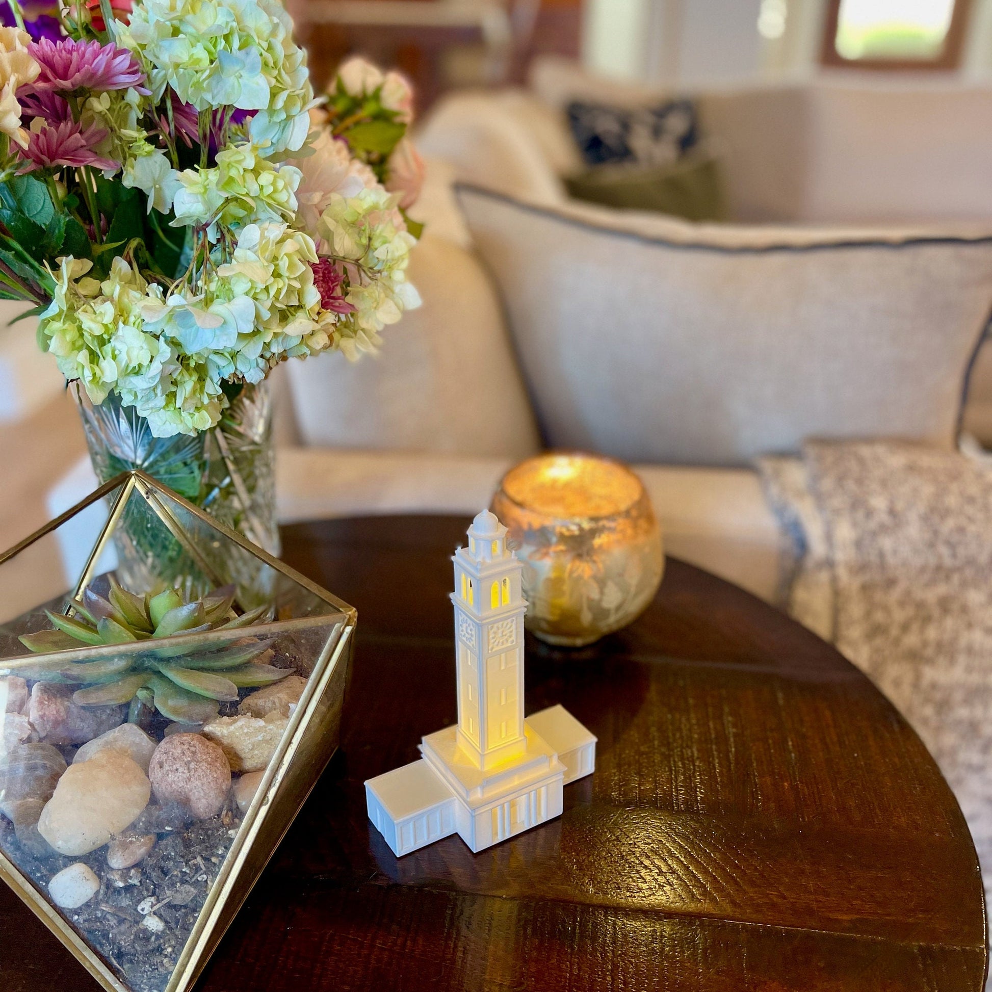 The LSU Memorial Tower figurine with light, shown in a living room.