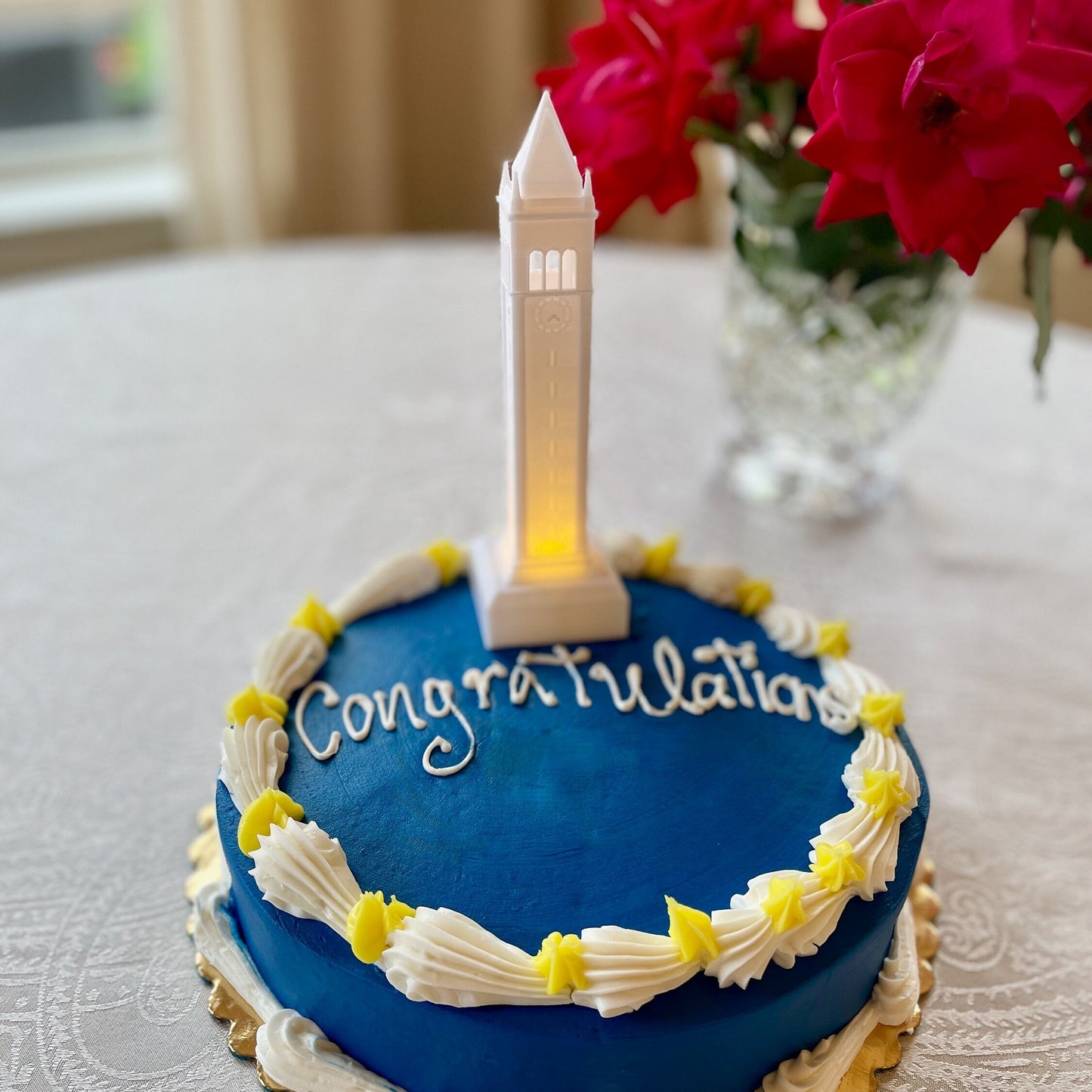 The Berkeley cake topper, shown on a Berkeley graduation cake and designed in honor of the Campanile.