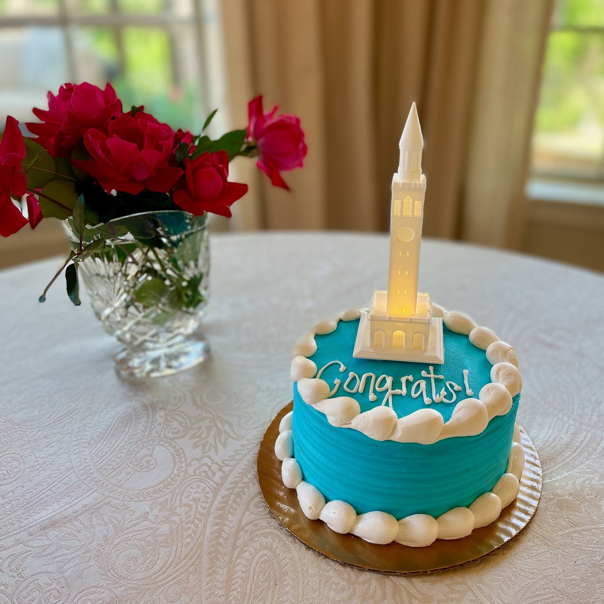 The UNC cake topper light, designed as a replica of the UNC Bell Tower in Chapel Hill.